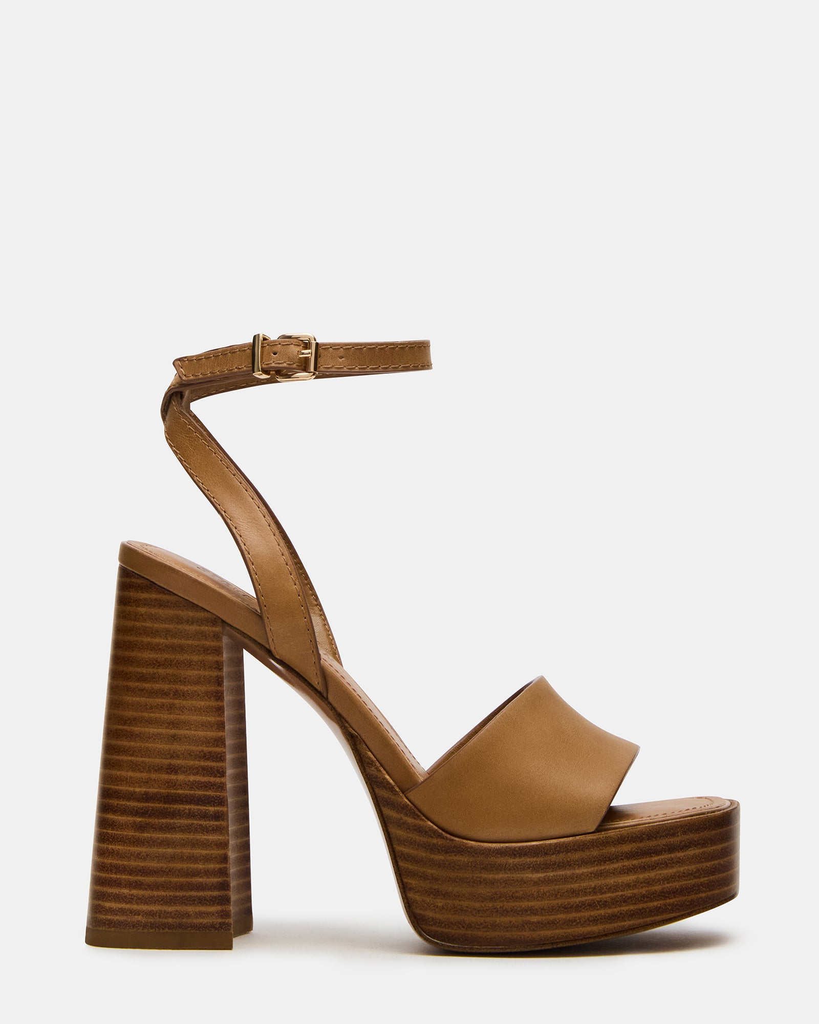 Brown leather heels showcasing the strappy design and platform block heel.