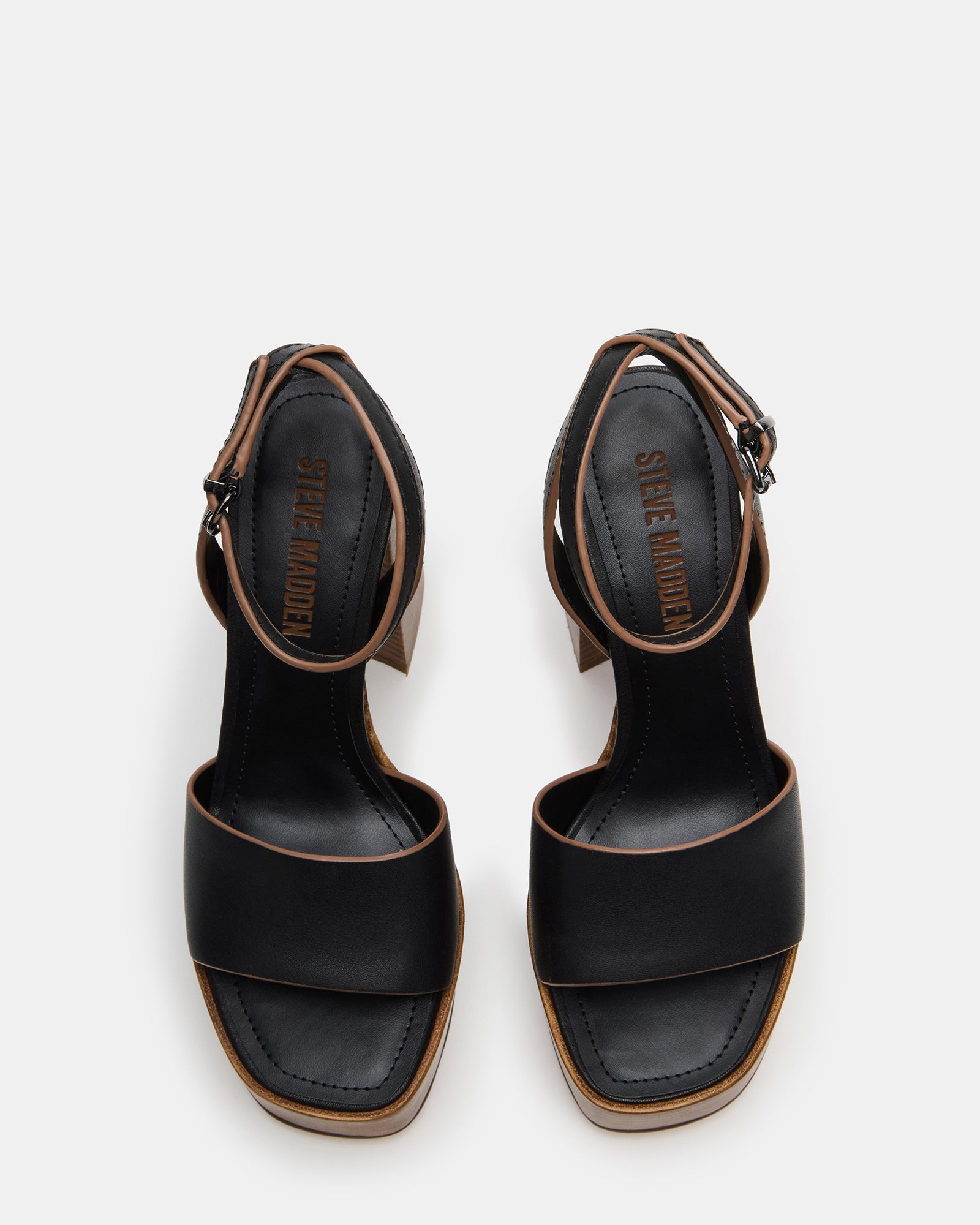 Floria black leather sandals side view on marble floor