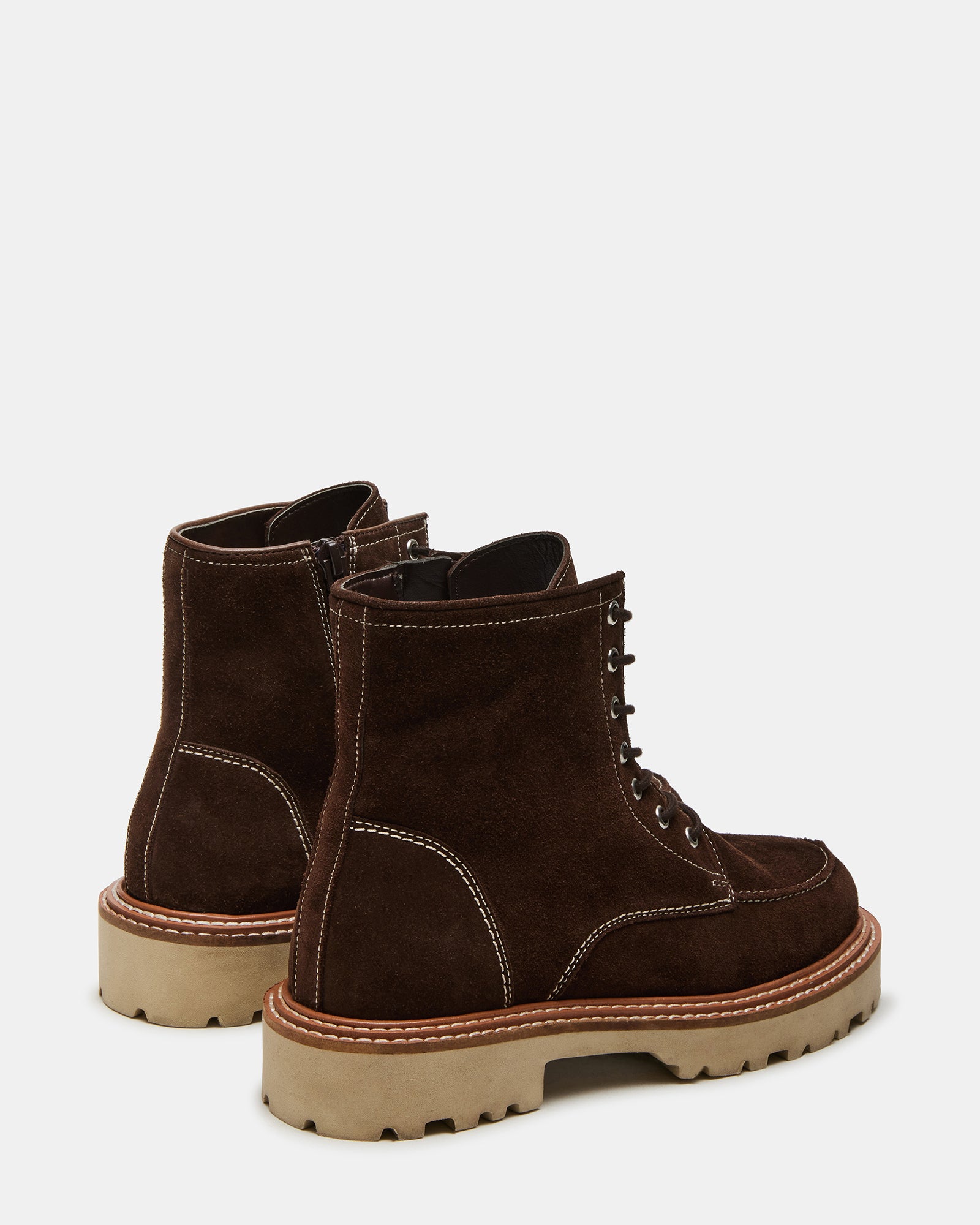 Side angle of womens boots highlighting suede texture and lug sole