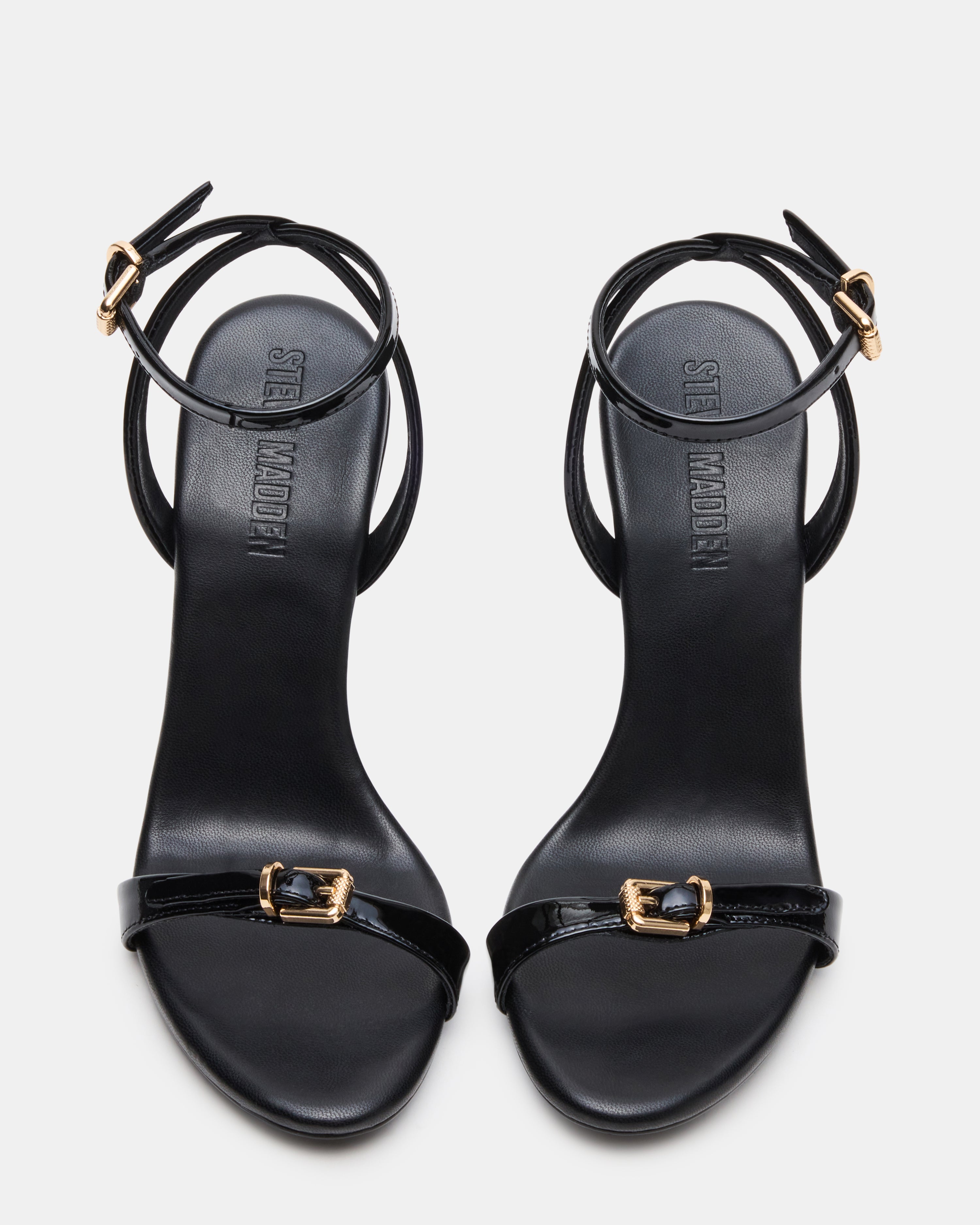 Side view of womens black patent stiletto heels showcasing the elegant design.