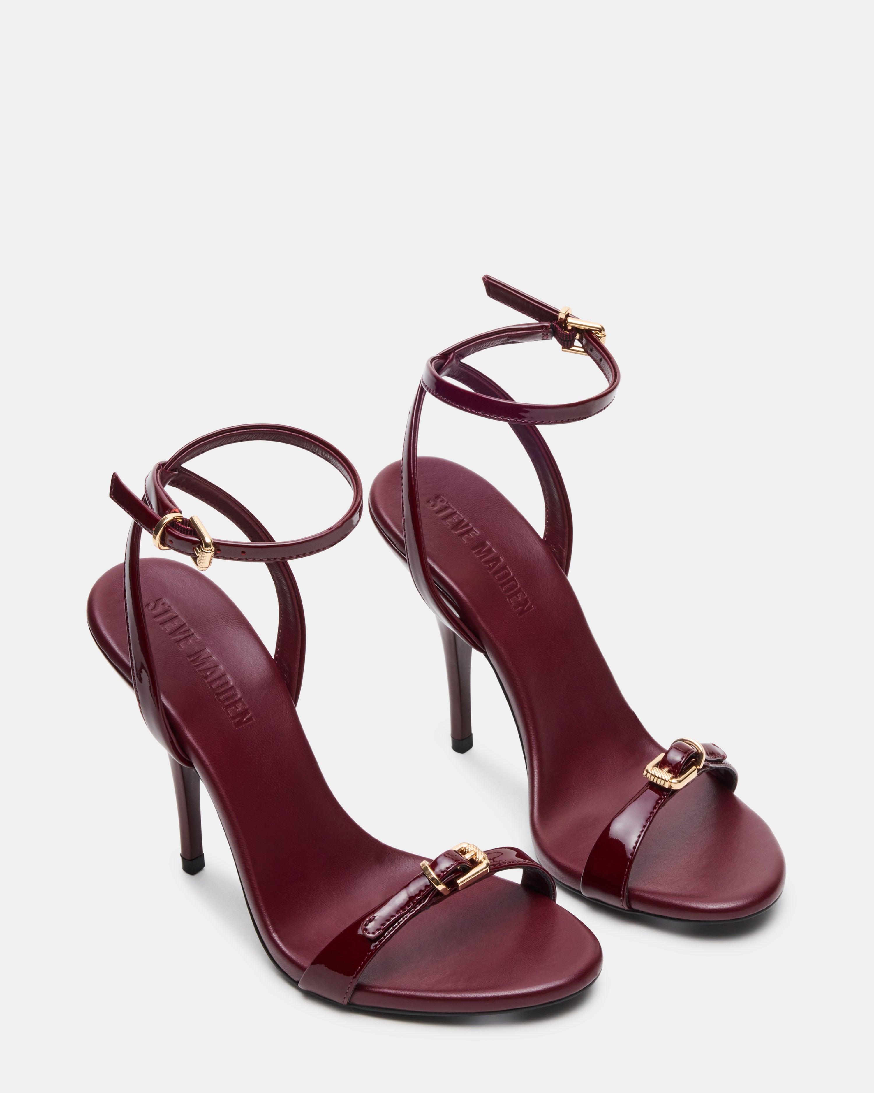 Close-up of the open toe design of burgundy slingback heels.