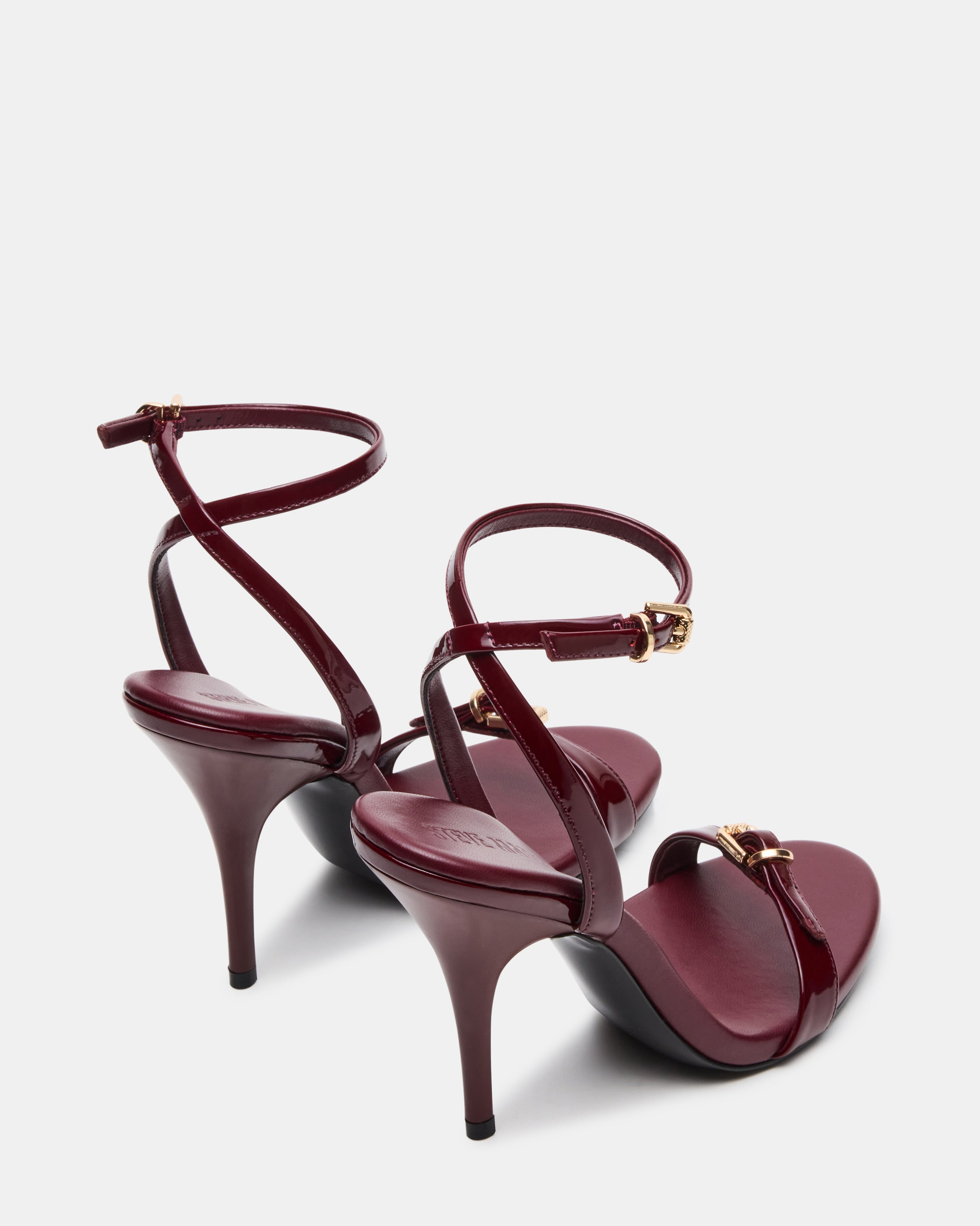 Close-up of the open toe design of burgundy slingback heels.