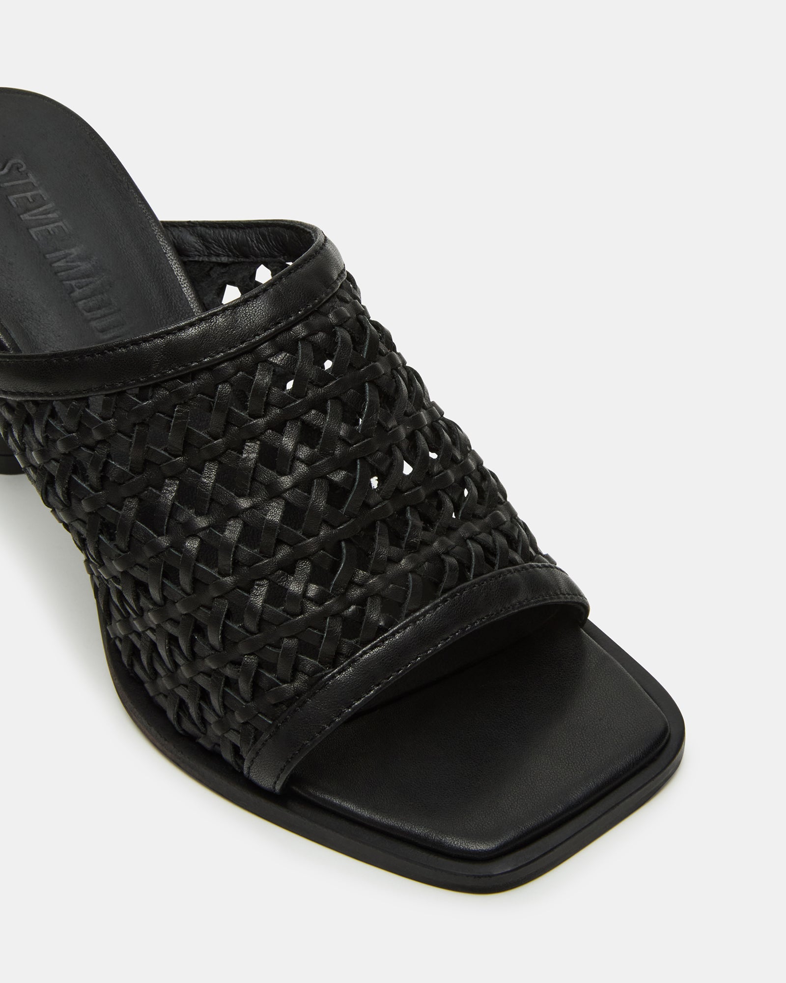 Fresca Noir mules styled with a casual outfit, perfect for a day out.