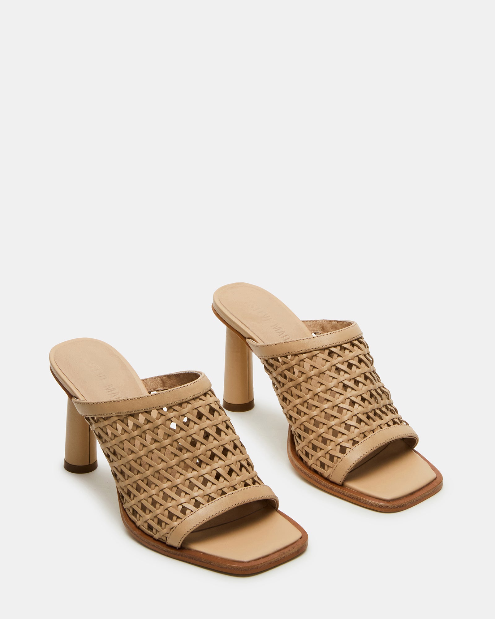 Close-up of square toe mules heels with stitching detail and matte finish