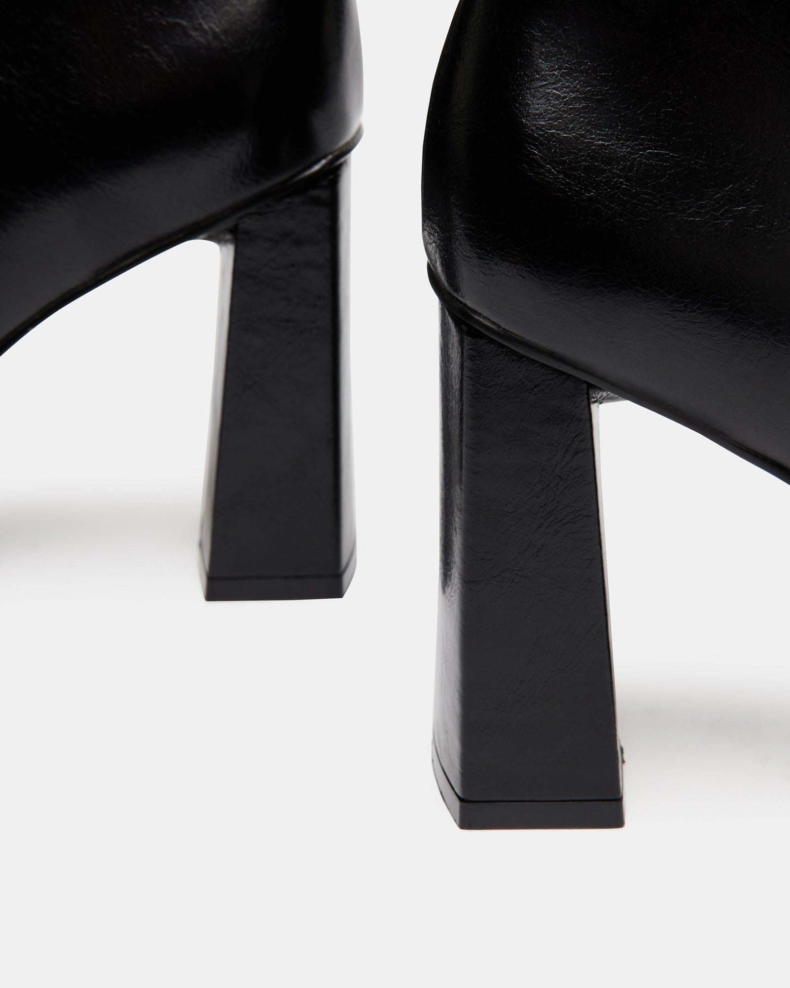 Side view of FREYA black leather square toe booties showcasing the chunky heel