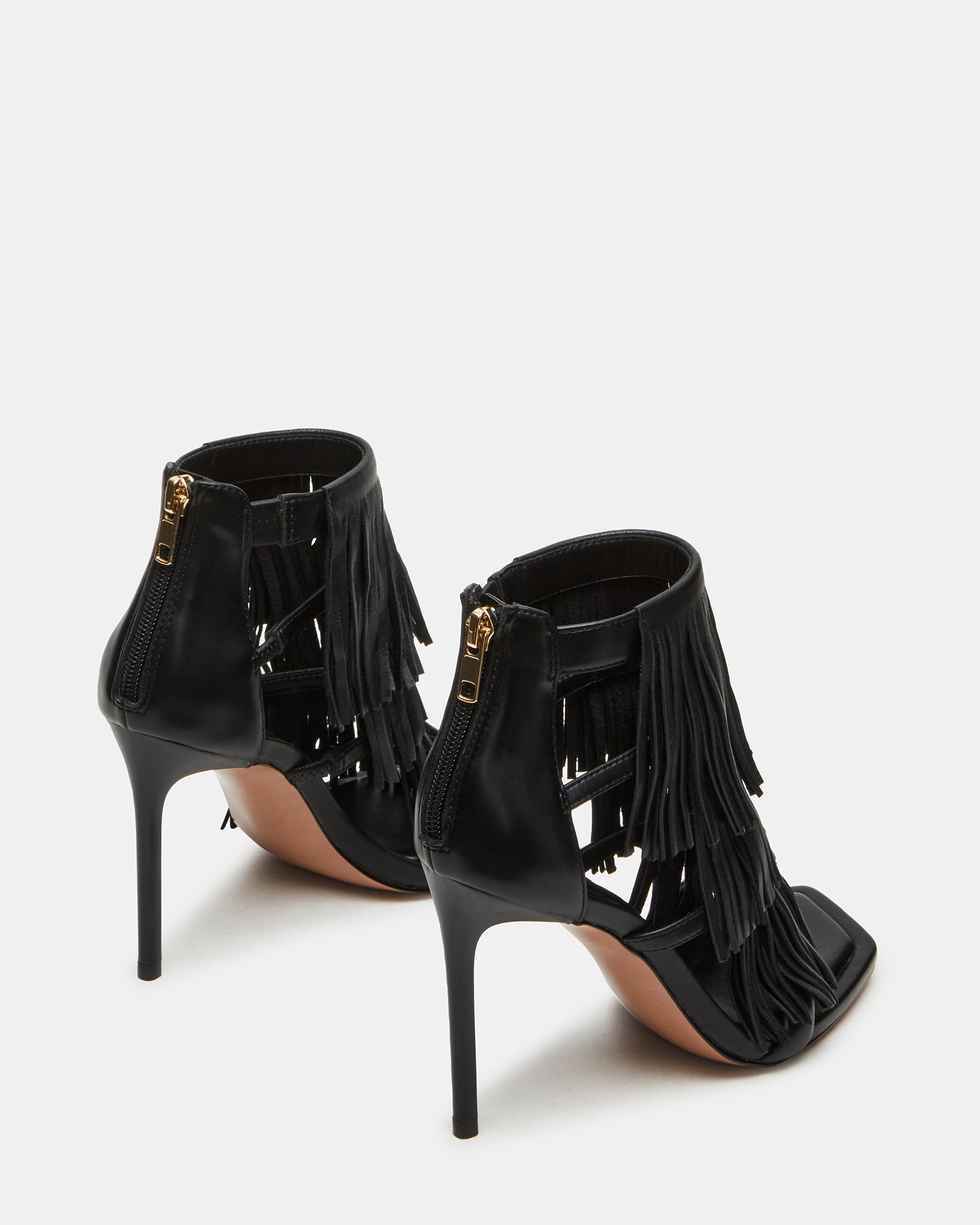 Close-up of square toe and fringe detail on fashion heels