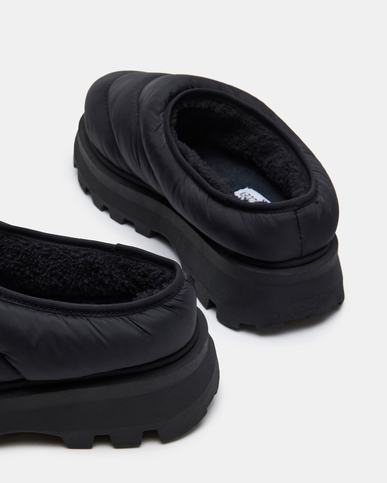 Side view of the mens slip-on shoes, highlighting the synthetic sole.
