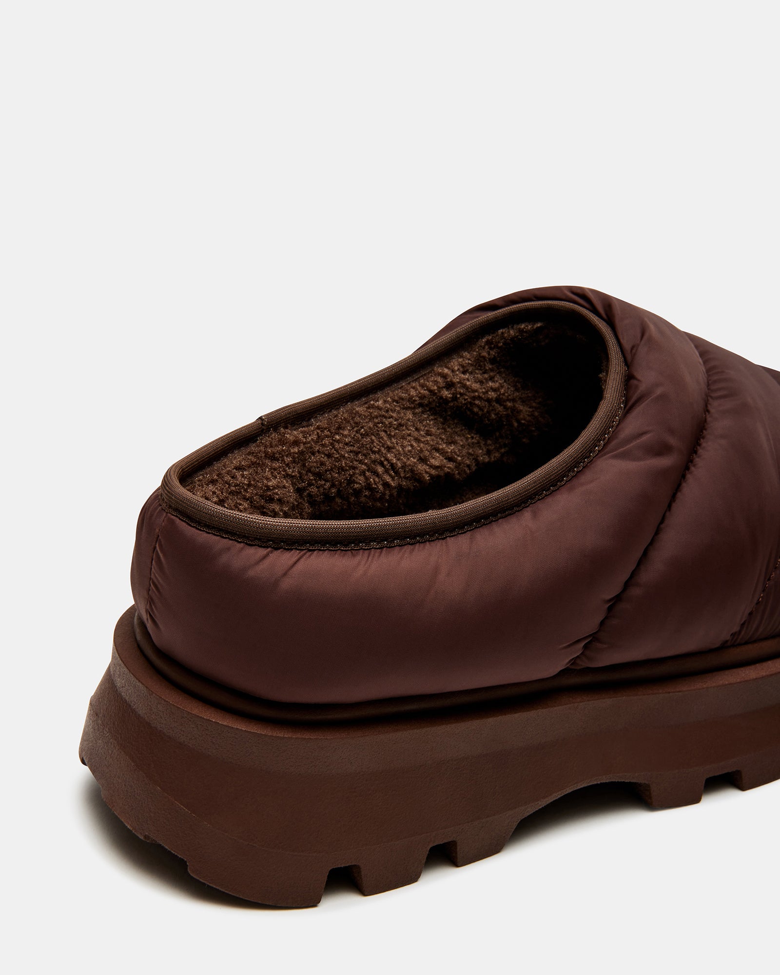 Side view of mens slip-on shoes highlighting the puffy platform design