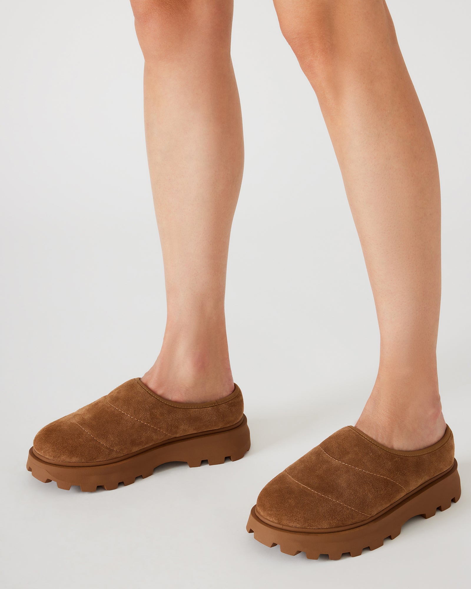 Side view of the mens slip-on shoes, highlighting the synthetic sole.