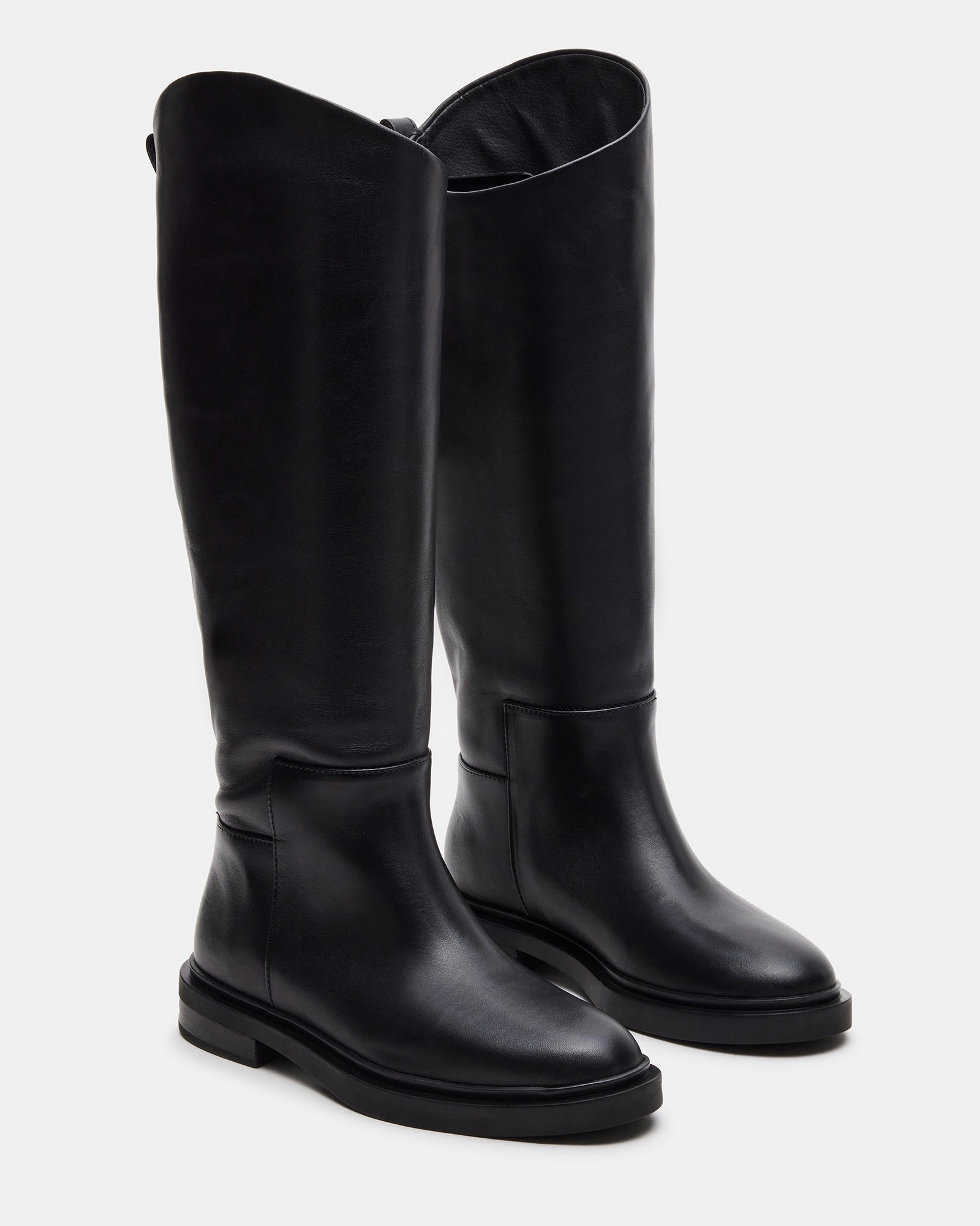 Close-up of Gaige black knee high boots highlighting the leather texture.