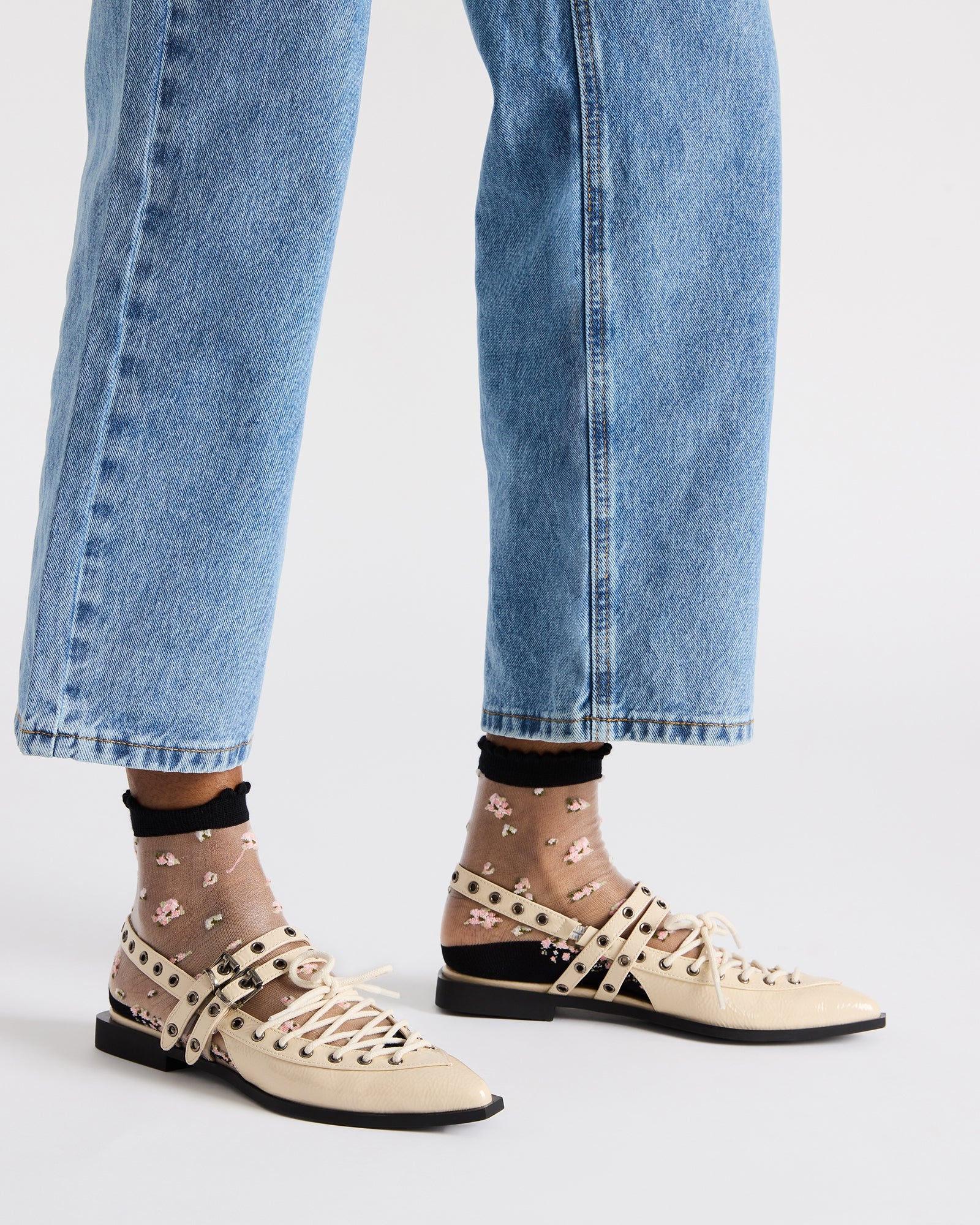 Side angle of black ballet flats with slingback strap detail