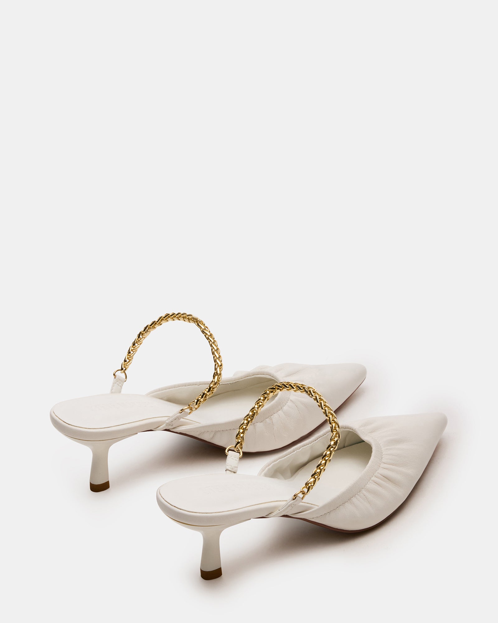 Close-up of the chain strap detail on Gala mules