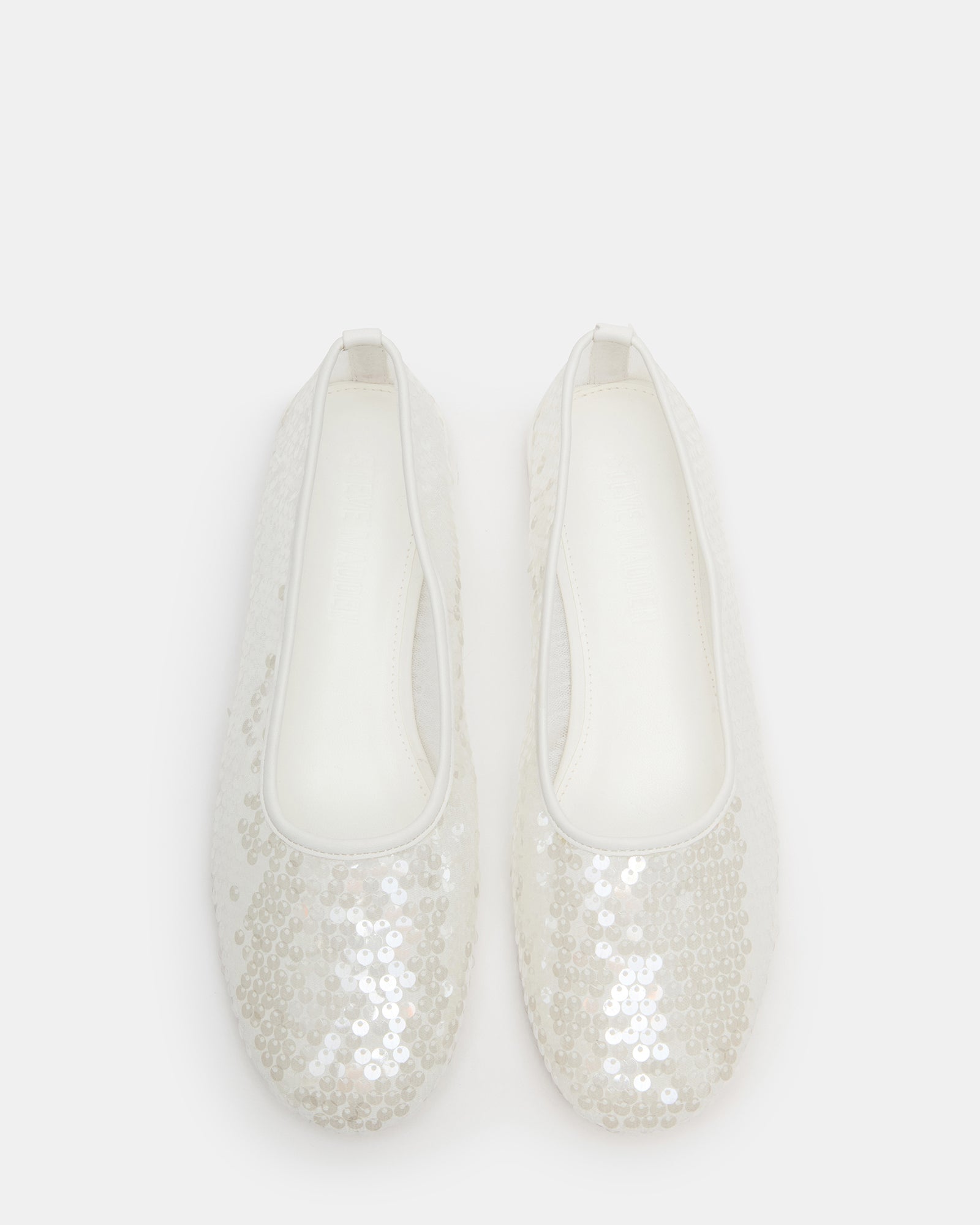 Close-up view of Garcelle black ballet flats with sequins.