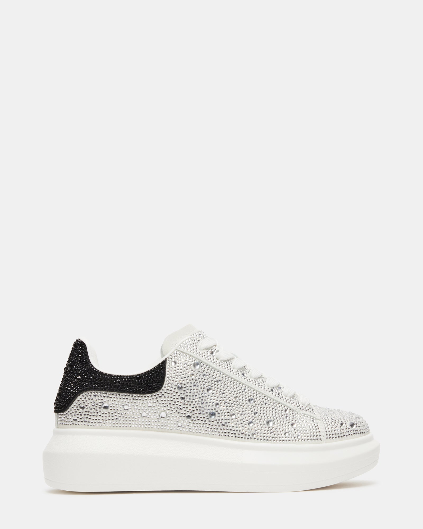 Close-up of rhinestone shoes on model standing in NYC streetwear