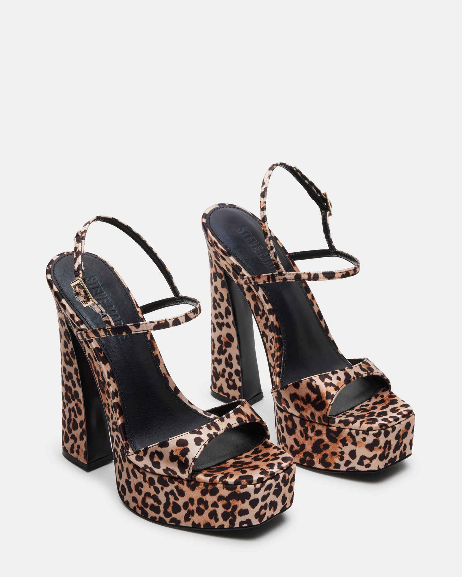 Detail shot of sandals high heels silver with textured leopard finish