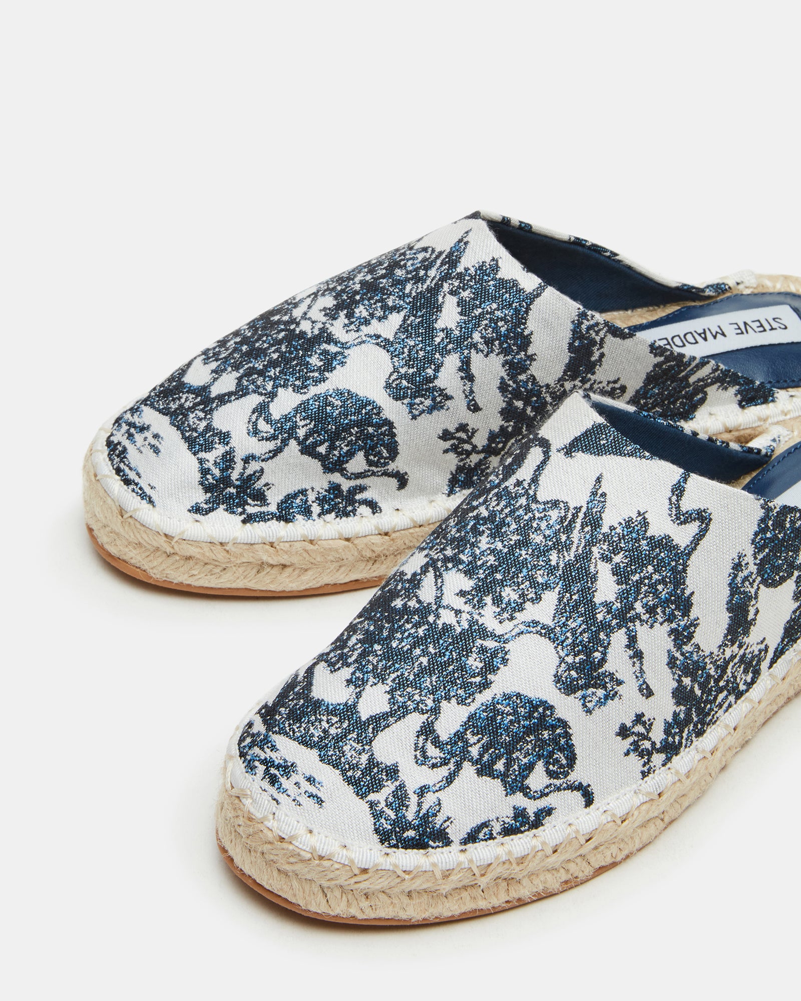 Fashionable espadrille shoes styled for everyday wear, featuring slip-on mules