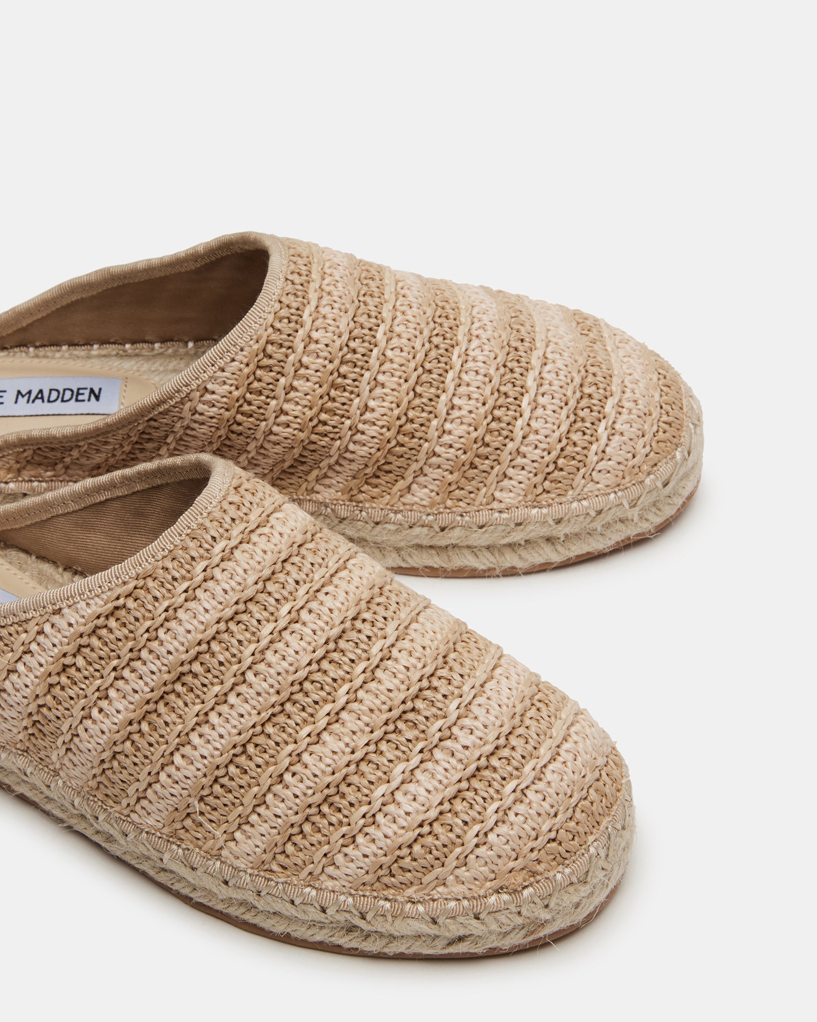Lifestyle image of womens comfortable mules shoes worn on vacation boardwalk