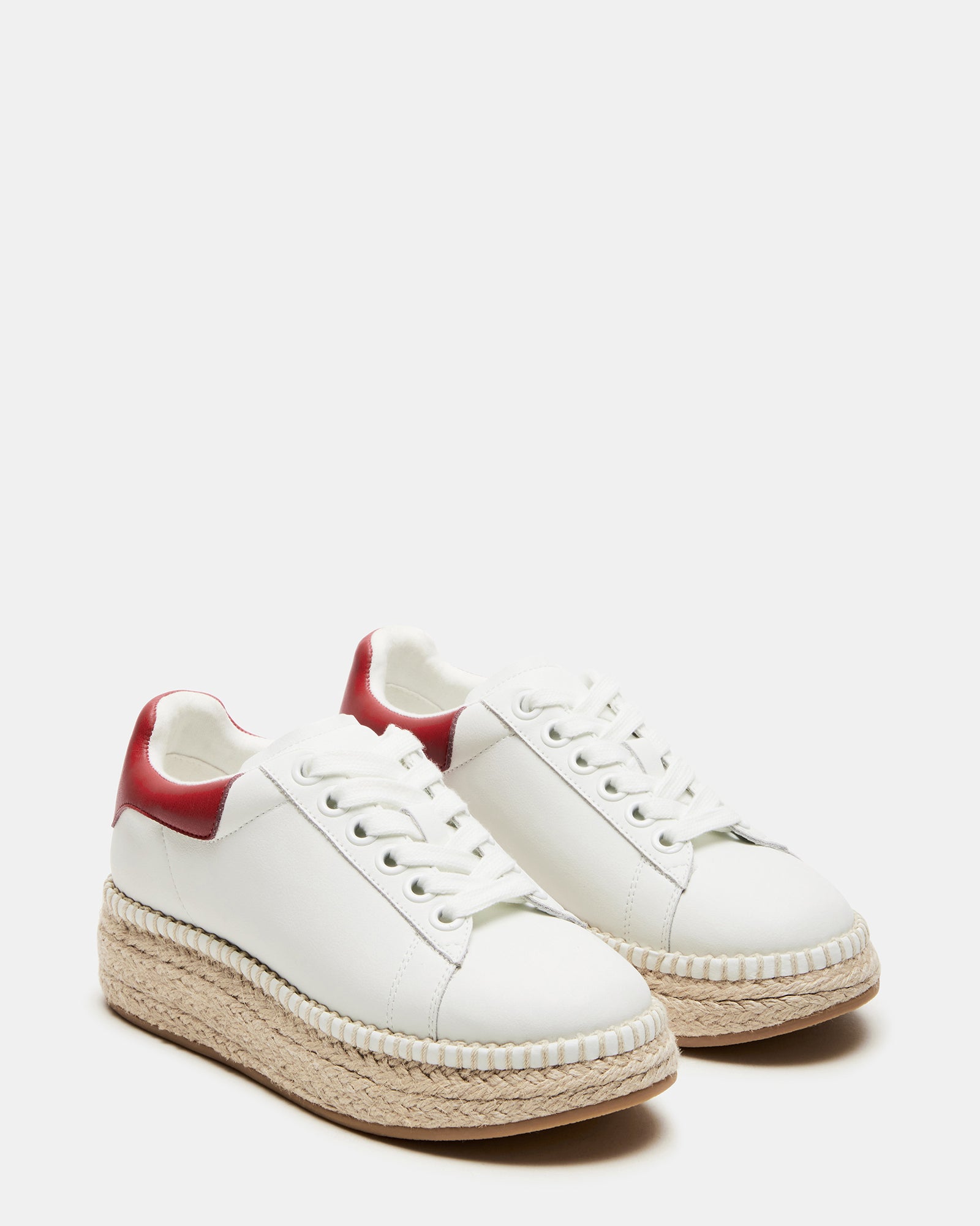 Close-up of red lace up shoes showing white leather and woven detail on heel, great for weekend wear.