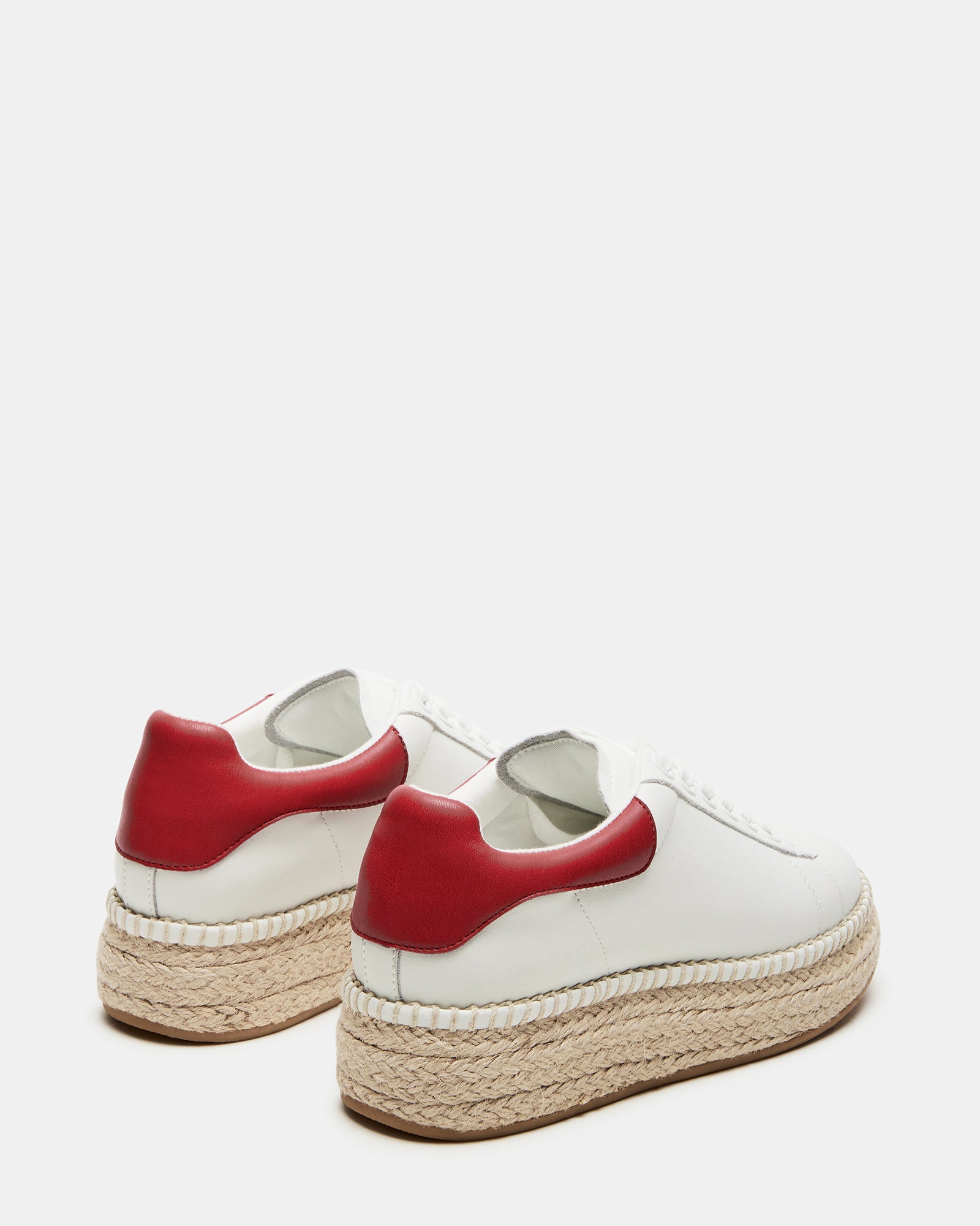 Close-up of red lace up shoes showing white leather and woven detail on heel, great for weekend wear.