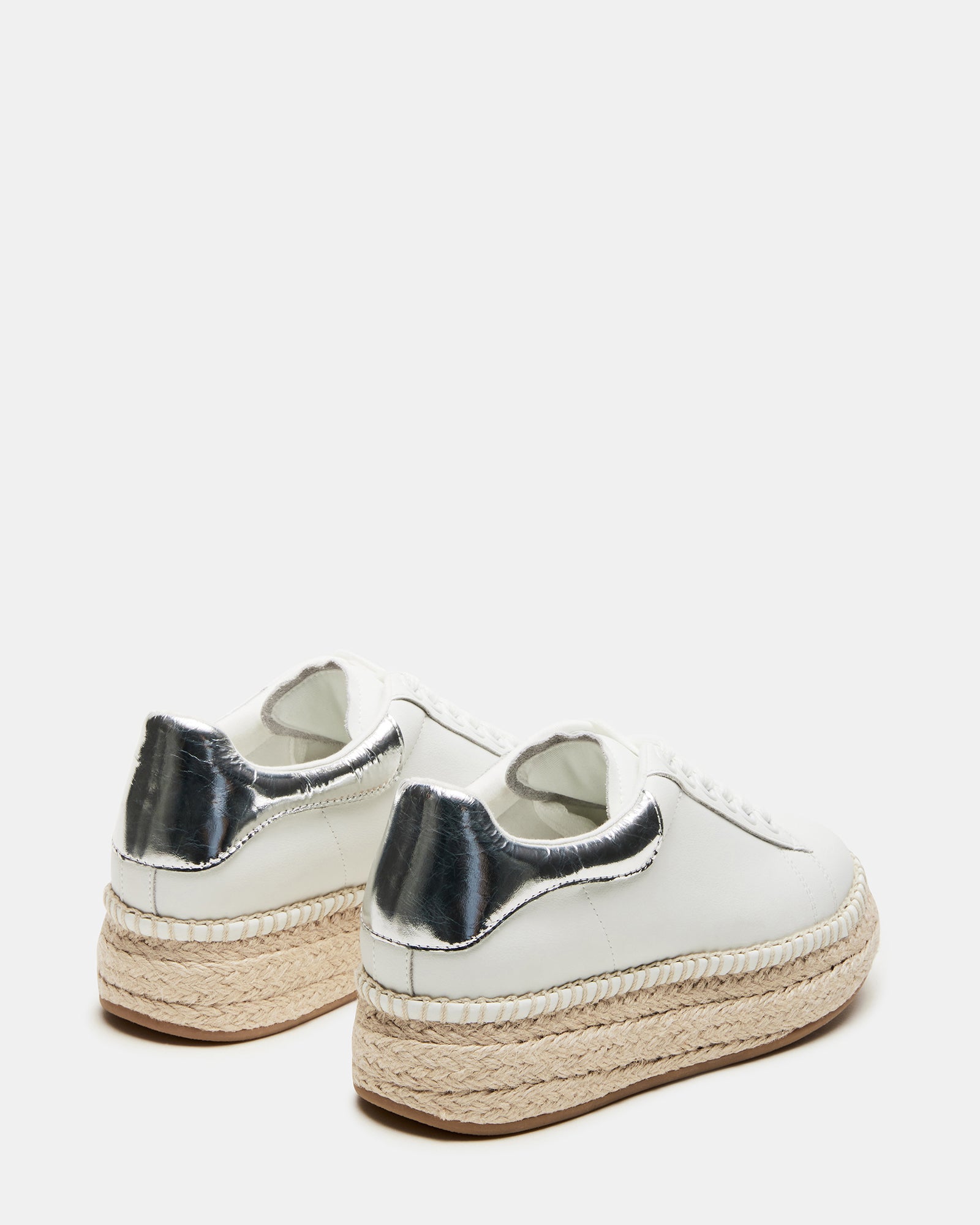 Close-up of the lace-up detail on GLANCE leather sneakers with playful metallic accents