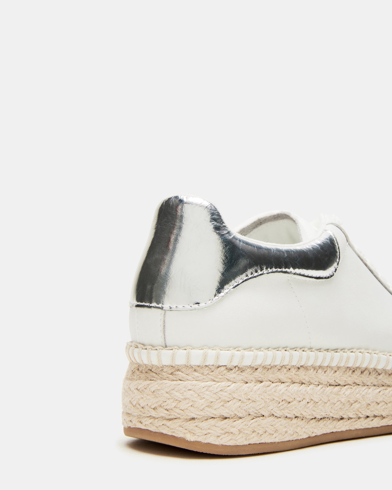 Styled outfit featuring GLANCE white leather sneakers with espadrille bottom for city strolls