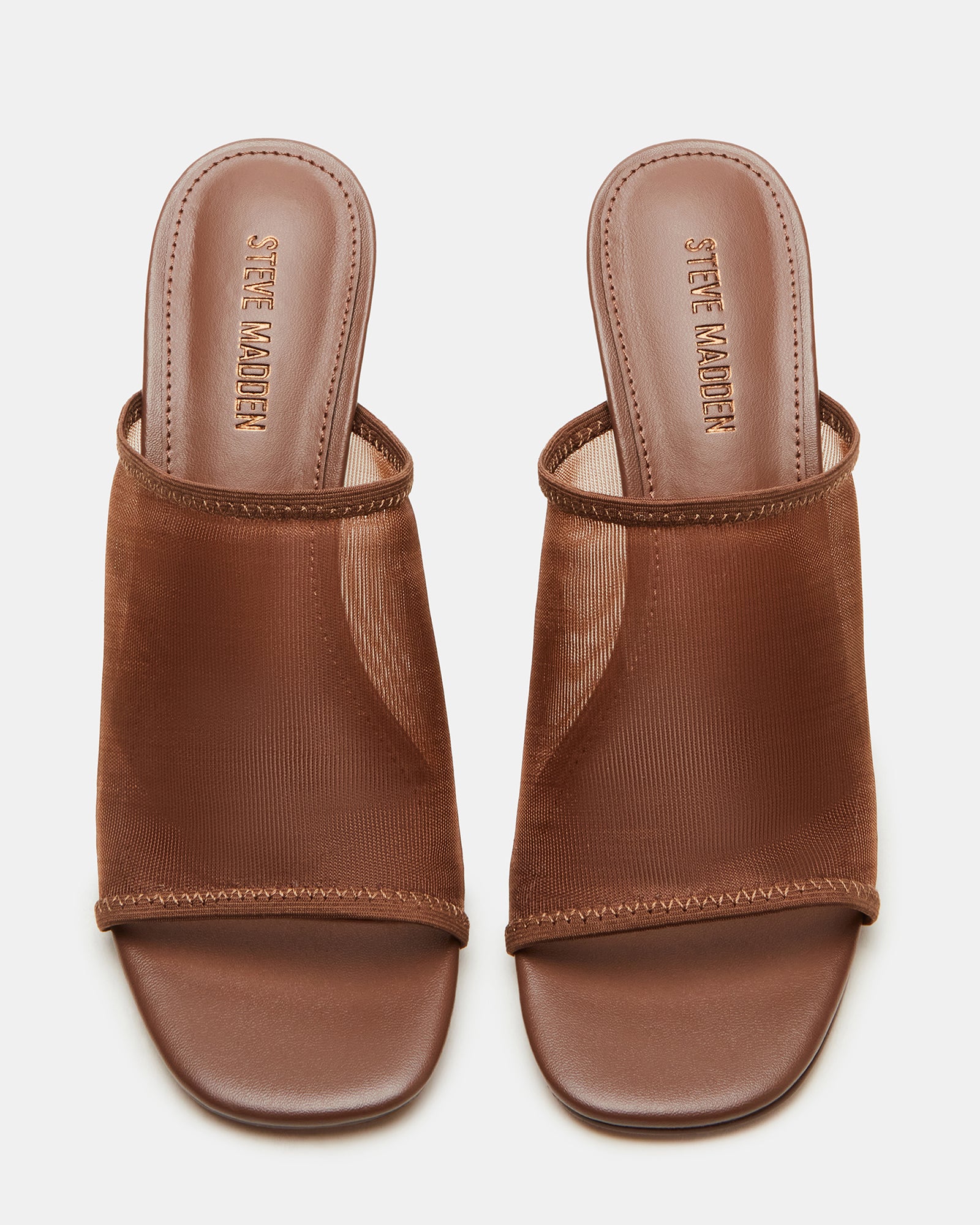 Close-up of square toe and mesh detailing on brown mules