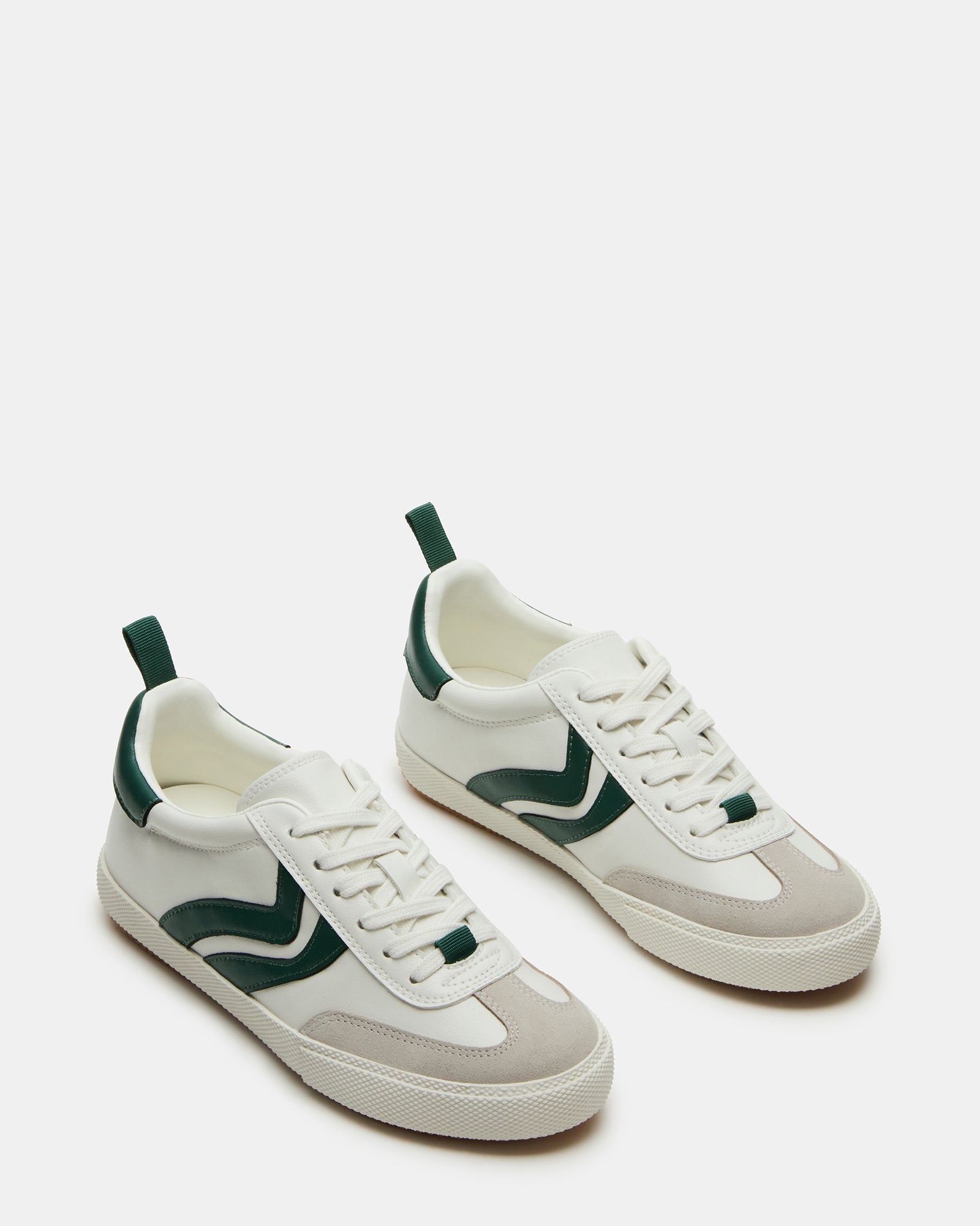 Close-up of lace-up sneakers showcasing vegan suede texture and stitching