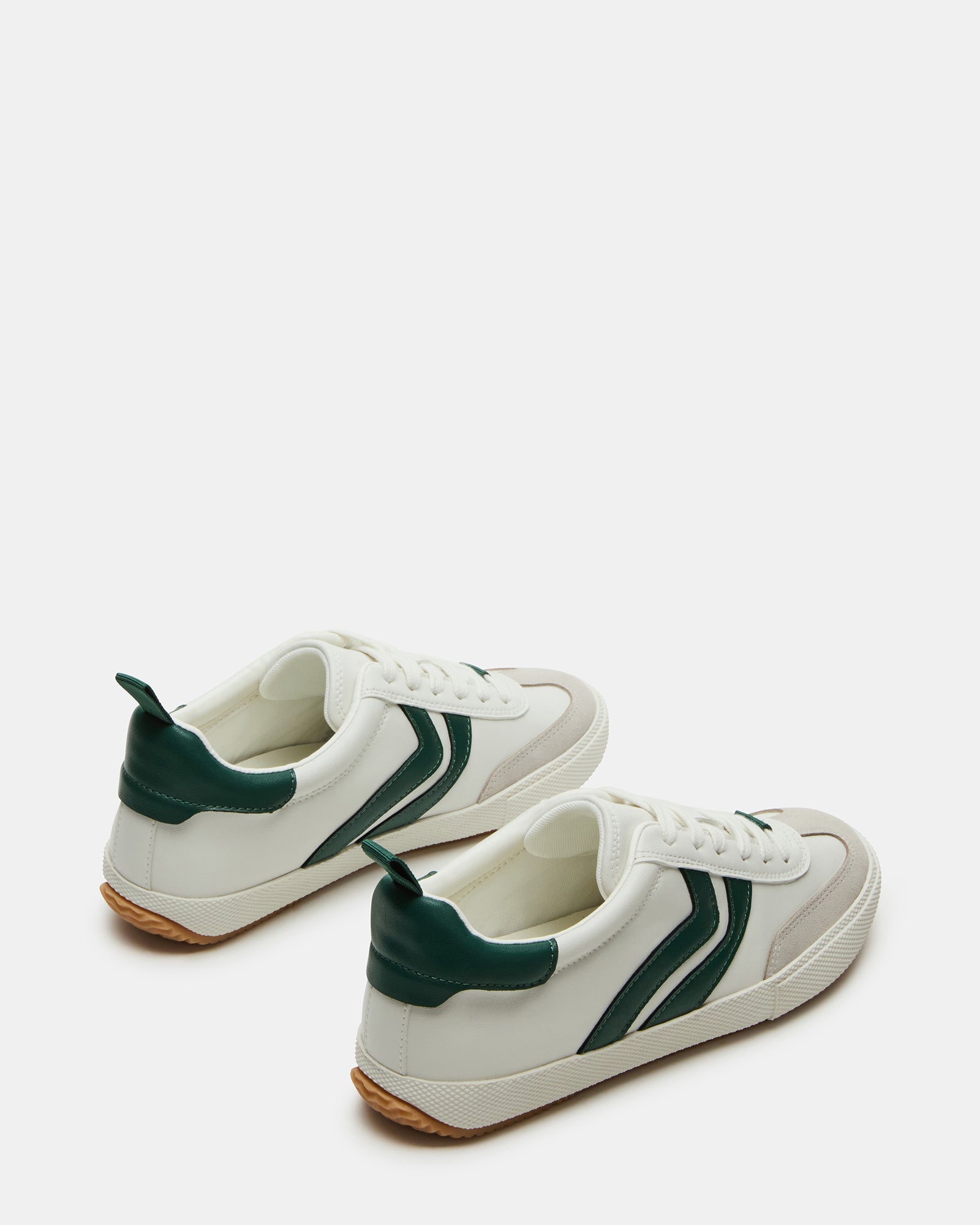 Close-up of lace-up sneakers showcasing vegan suede texture and stitching
