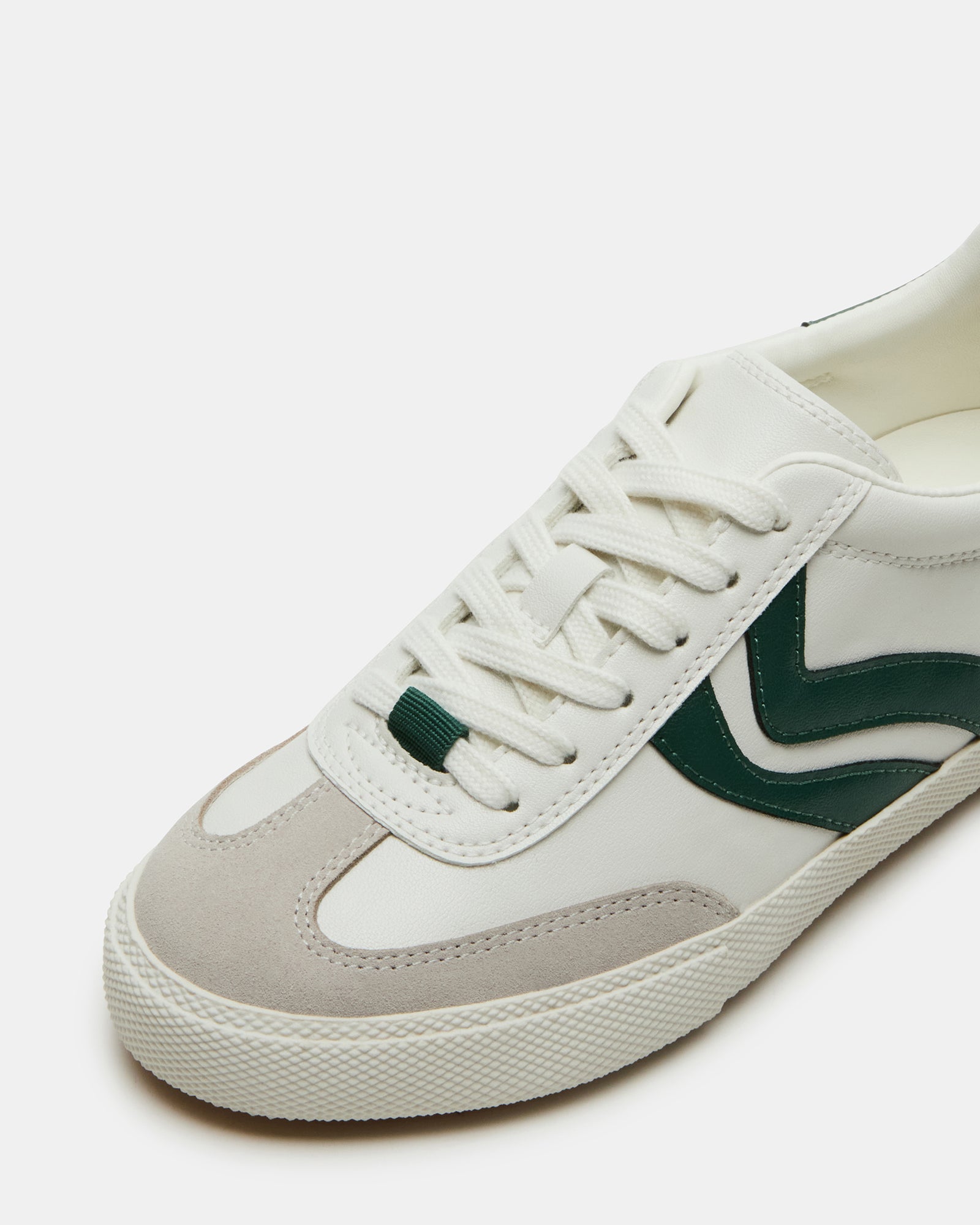 Top-down angle of sneakers worn outdoors near NYC skyline, ideal for walking