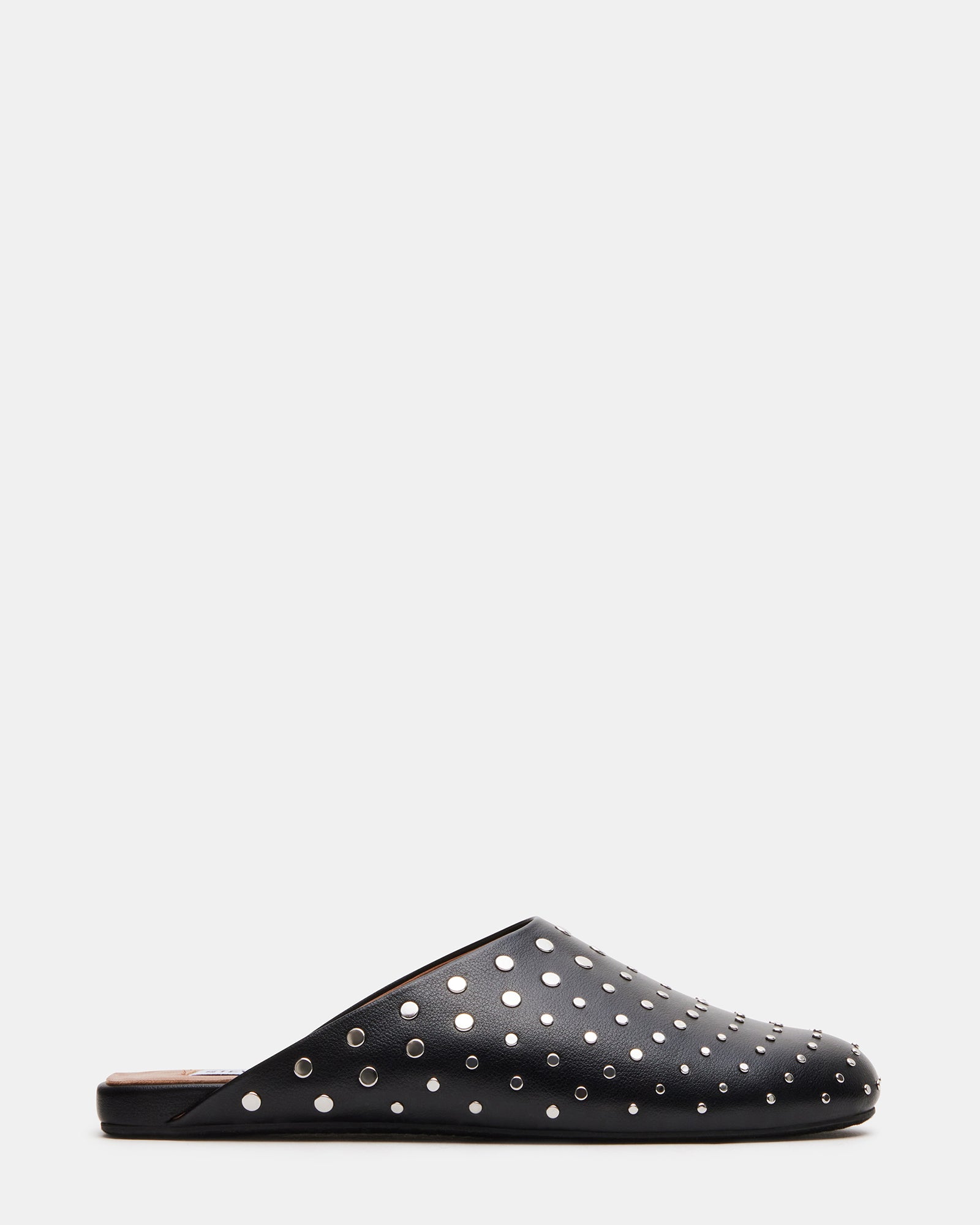Black studded flat mules from a side angle, highlighting the stud details.