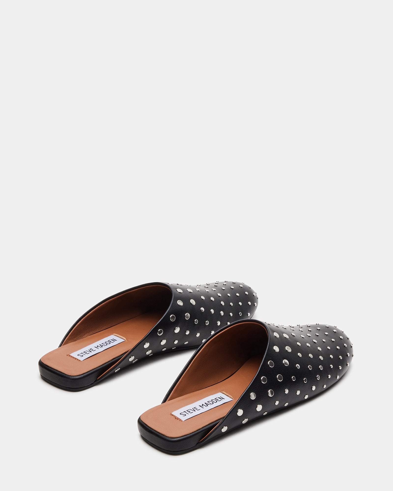 Front view of ladies mules flat, showing slip-on design and sleek silhouette.