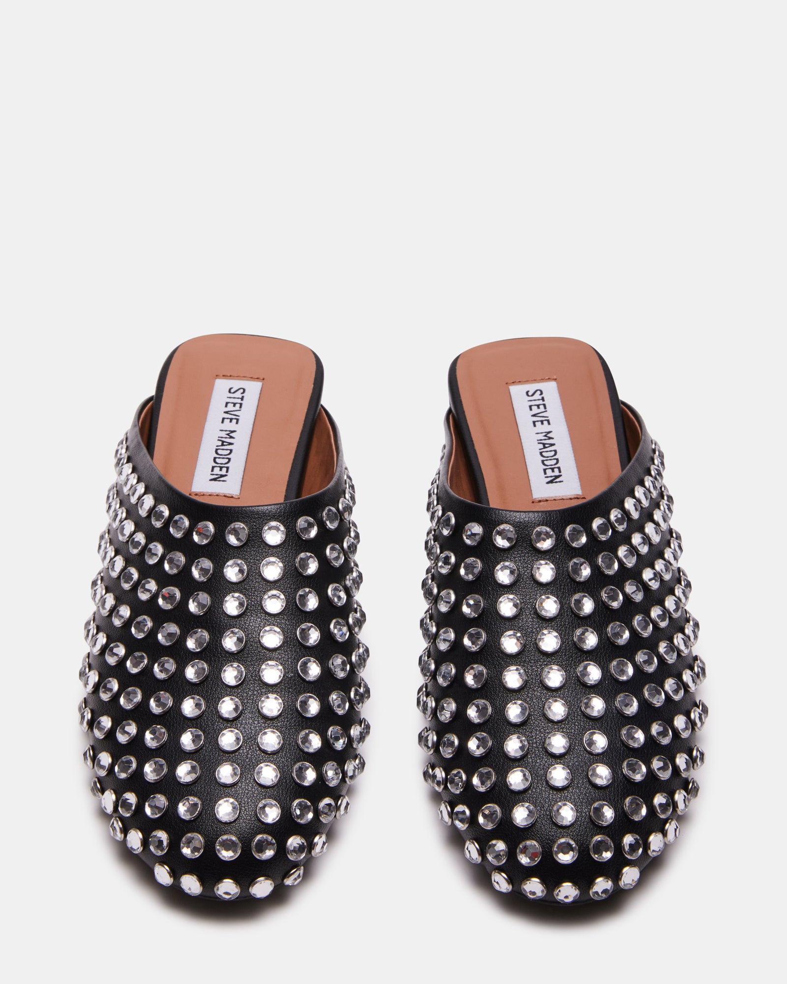 Top-down shot of vegan leather slip-on shoes with rhinestone accents