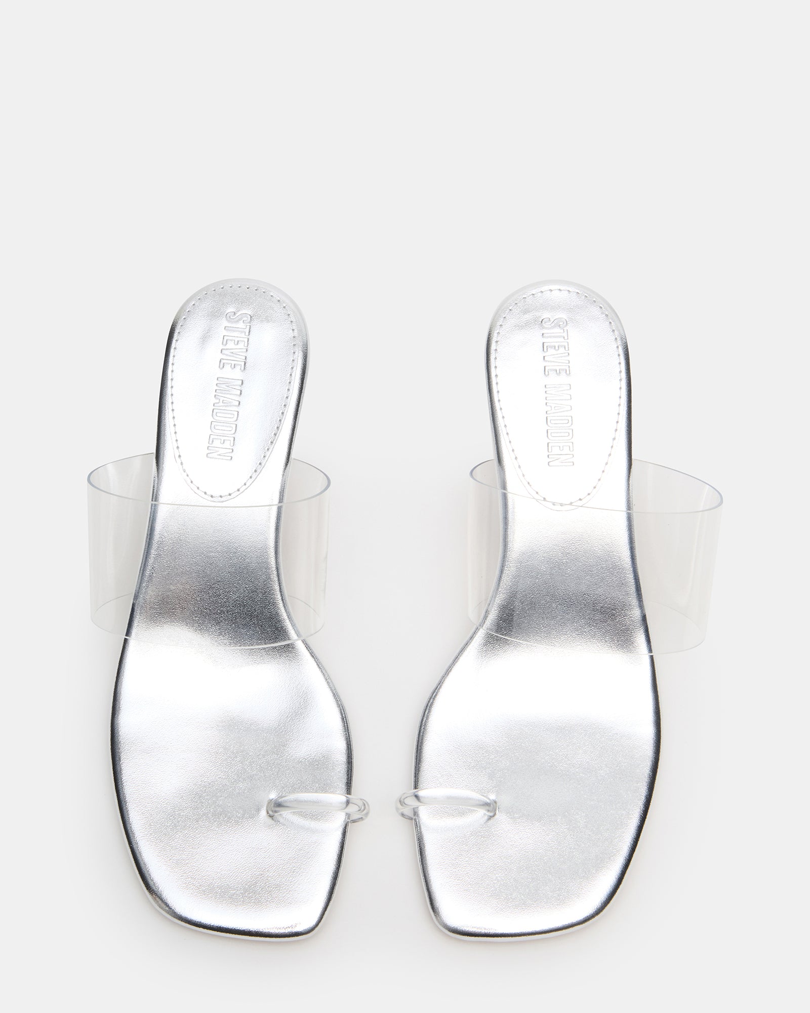 Glinda clear mule heels displayed from the side, highlighting their square toe design.