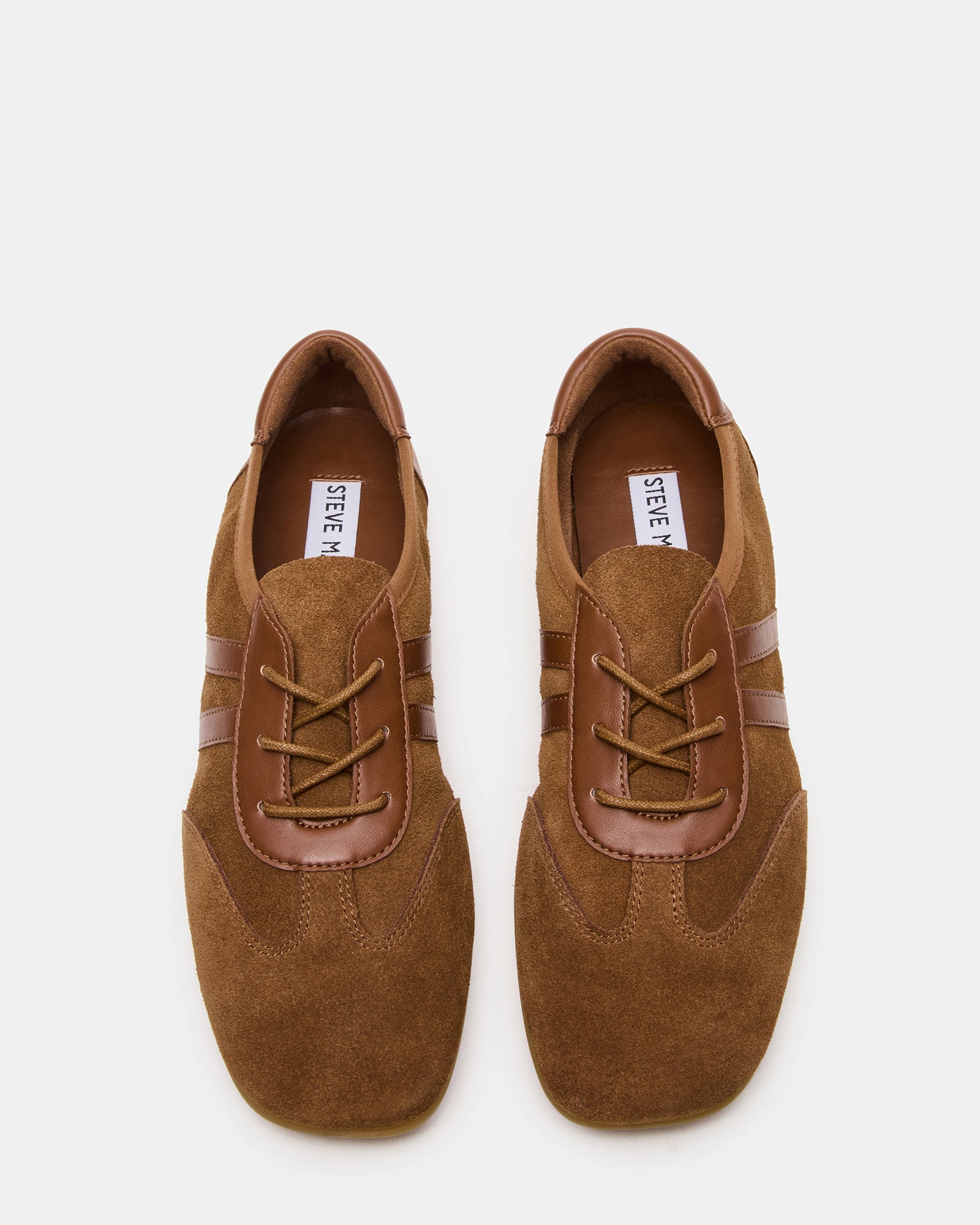 Front view of Glint chestnut suede sneakers for women, styled with casual outfits.
