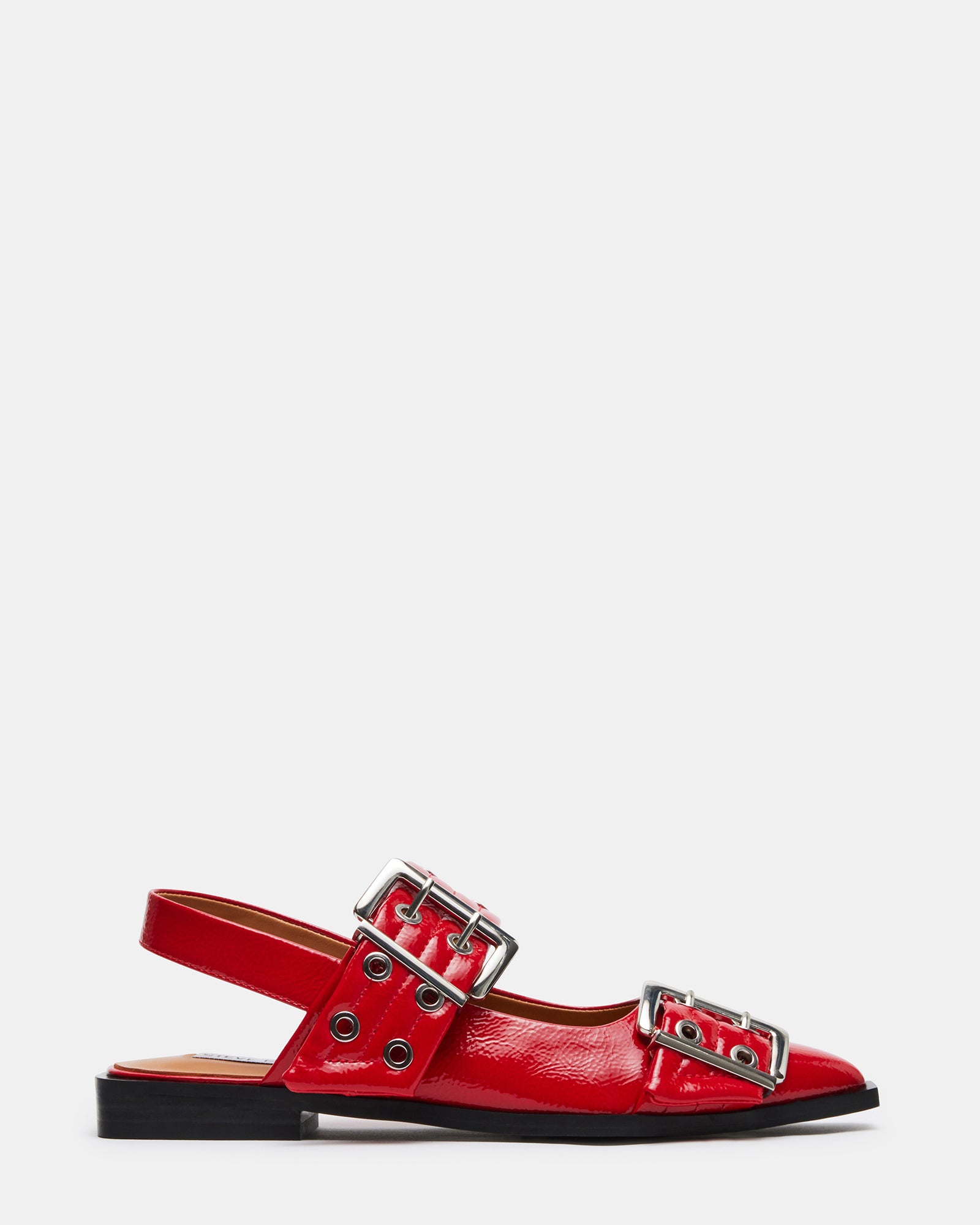 Graya red patent slingback flats styled with tailored black pants for a polished look.