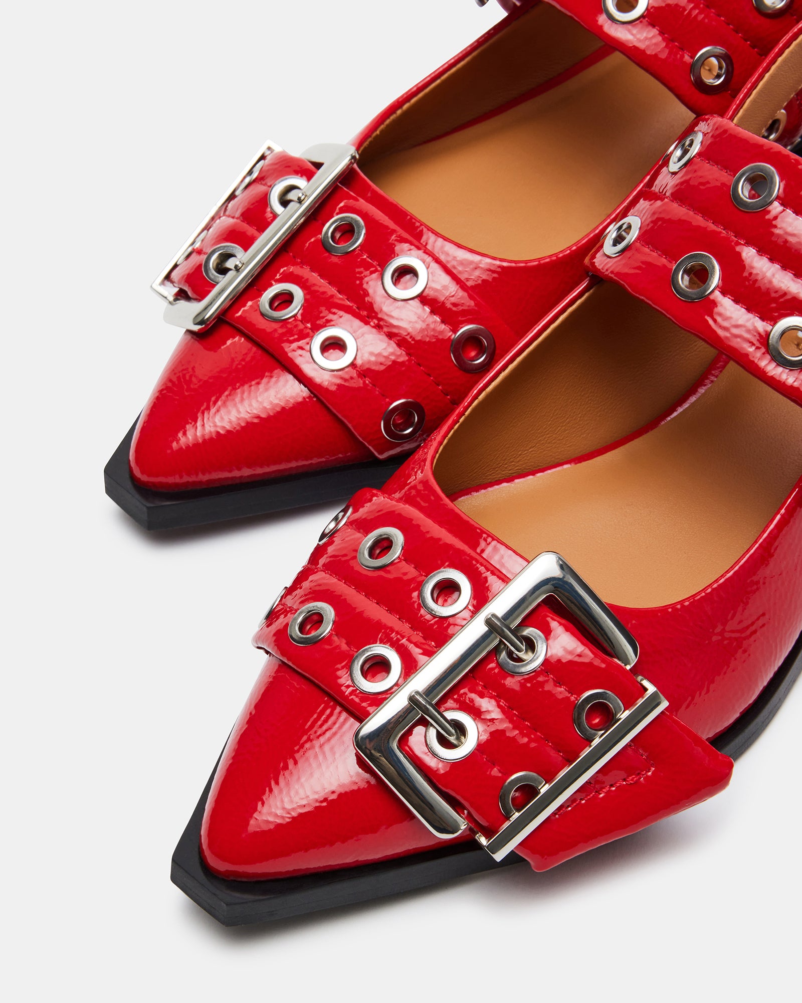 Graya red patent slingback flats styled with tailored black pants for a polished look.