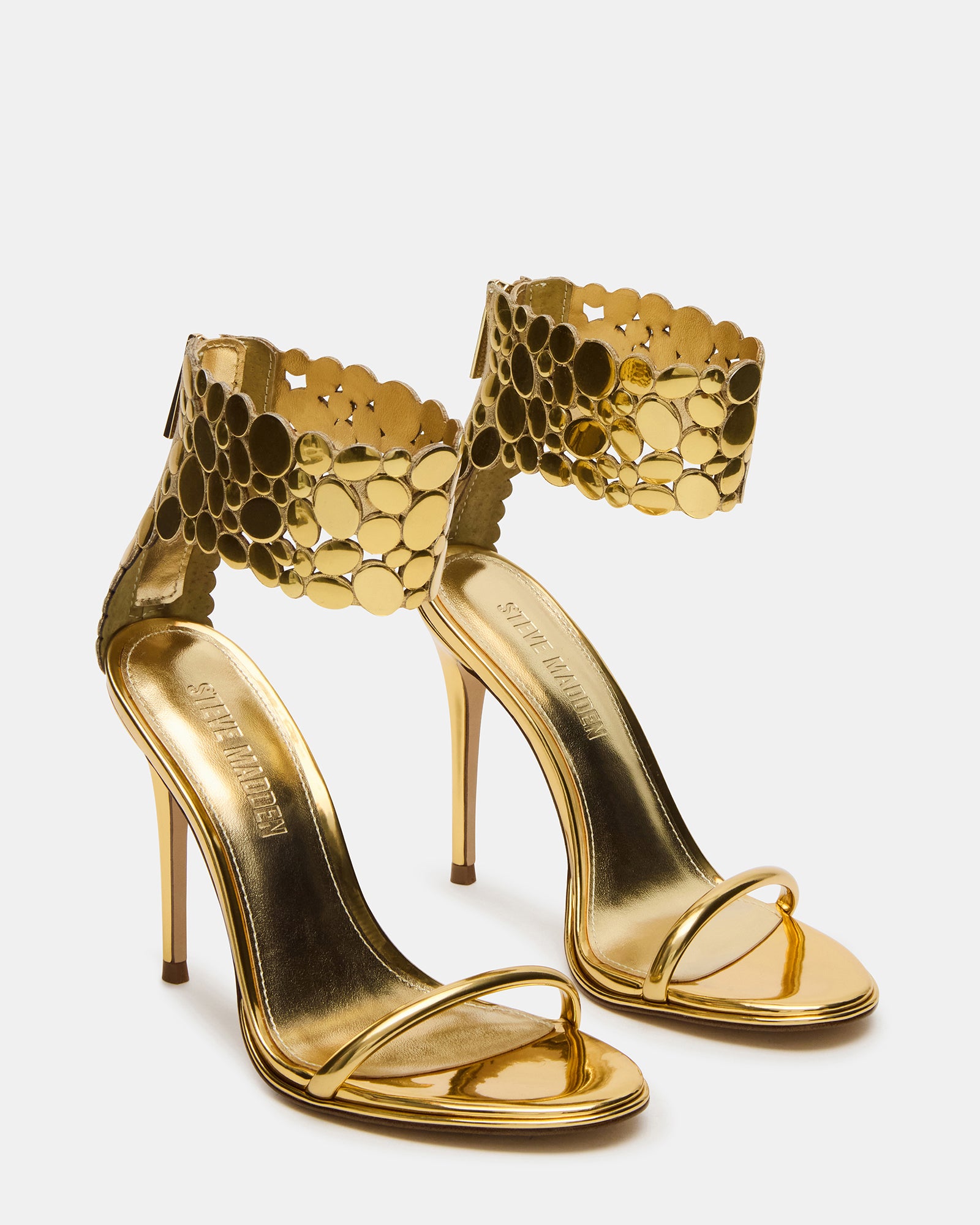 Close-up of black open toe heels showing rounded toe and synthetic material