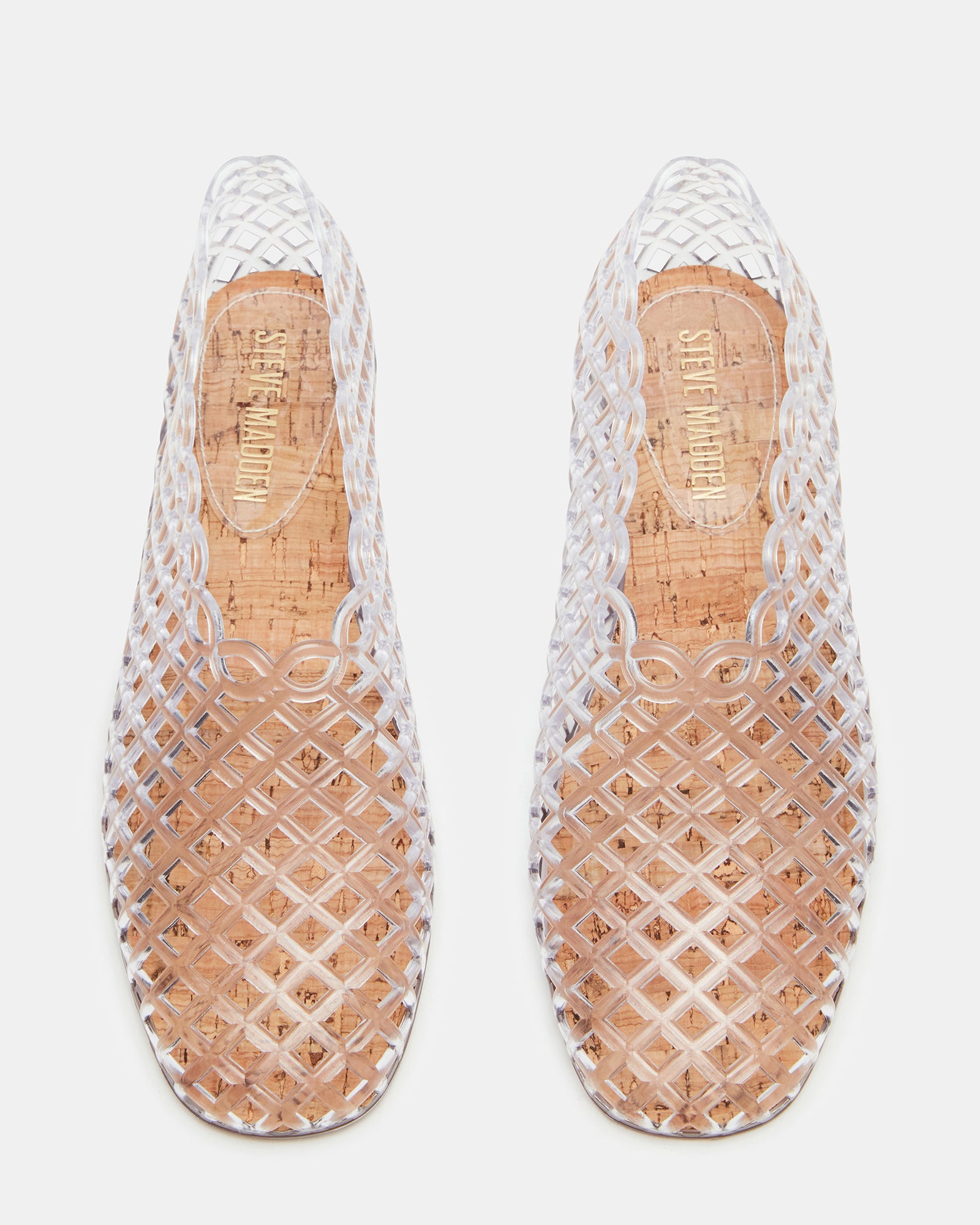 Side view of black flat sandals on pavement