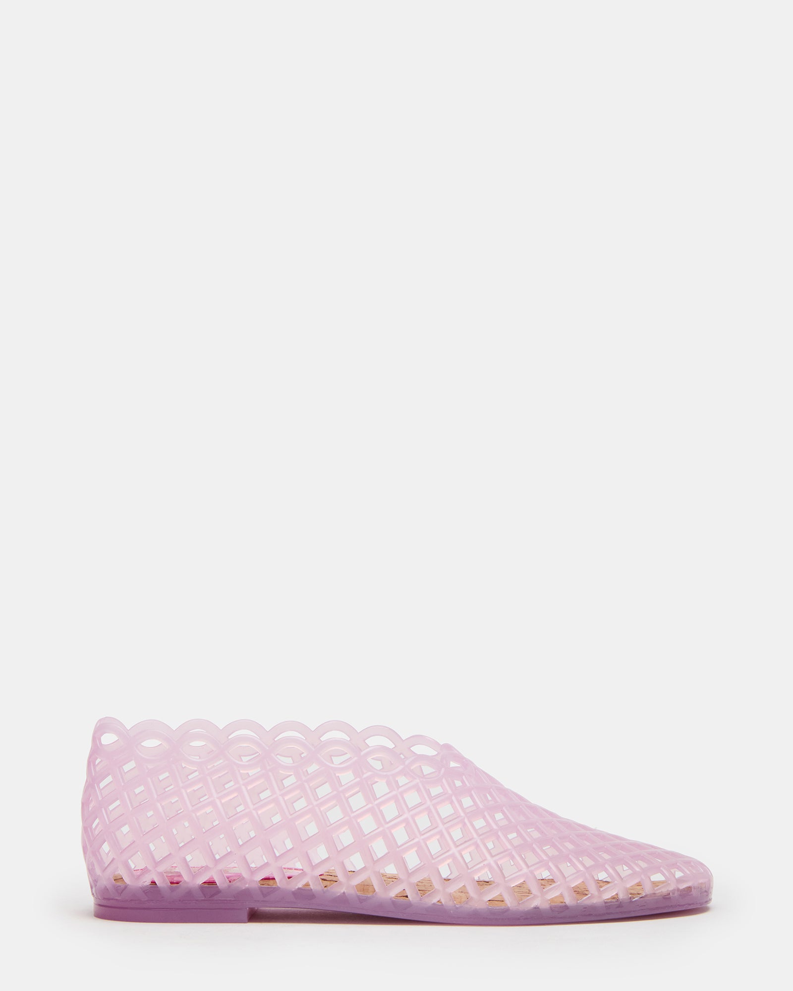 Close-up of clear jelly flats with square toe and blush pink finish