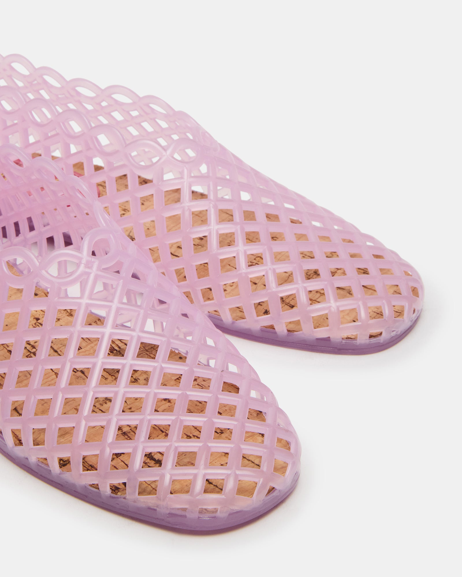 Lifestyle shot of jelly flats worn in casual spring outfit, on Texas sidewalk