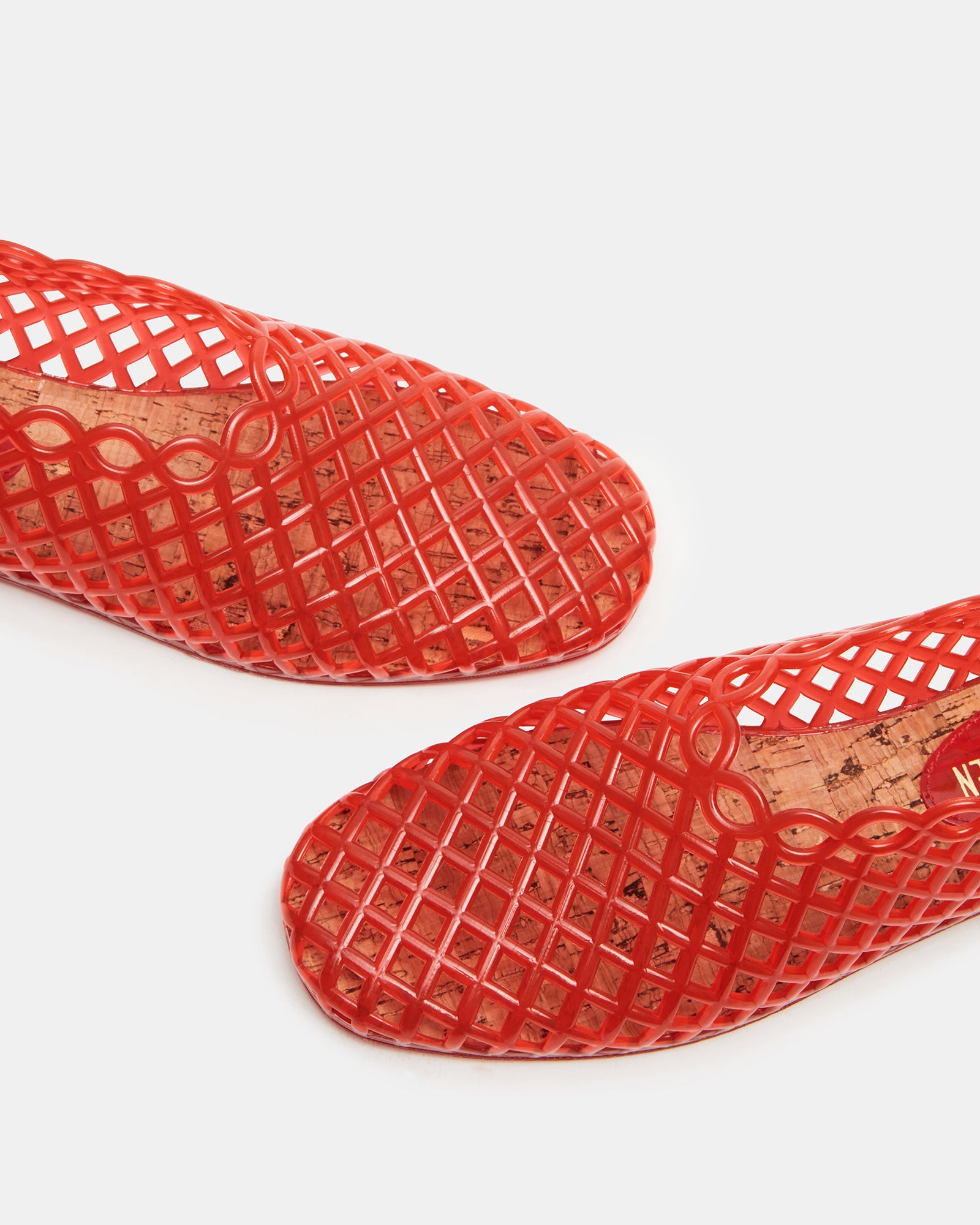 Front view of the Grove Red square toe jelly flats highlighting the modern design