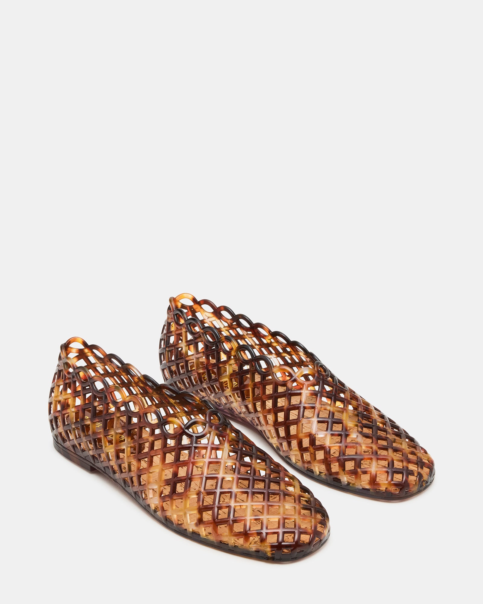Lifestyle image of flat sandals women wear on warm urban streets