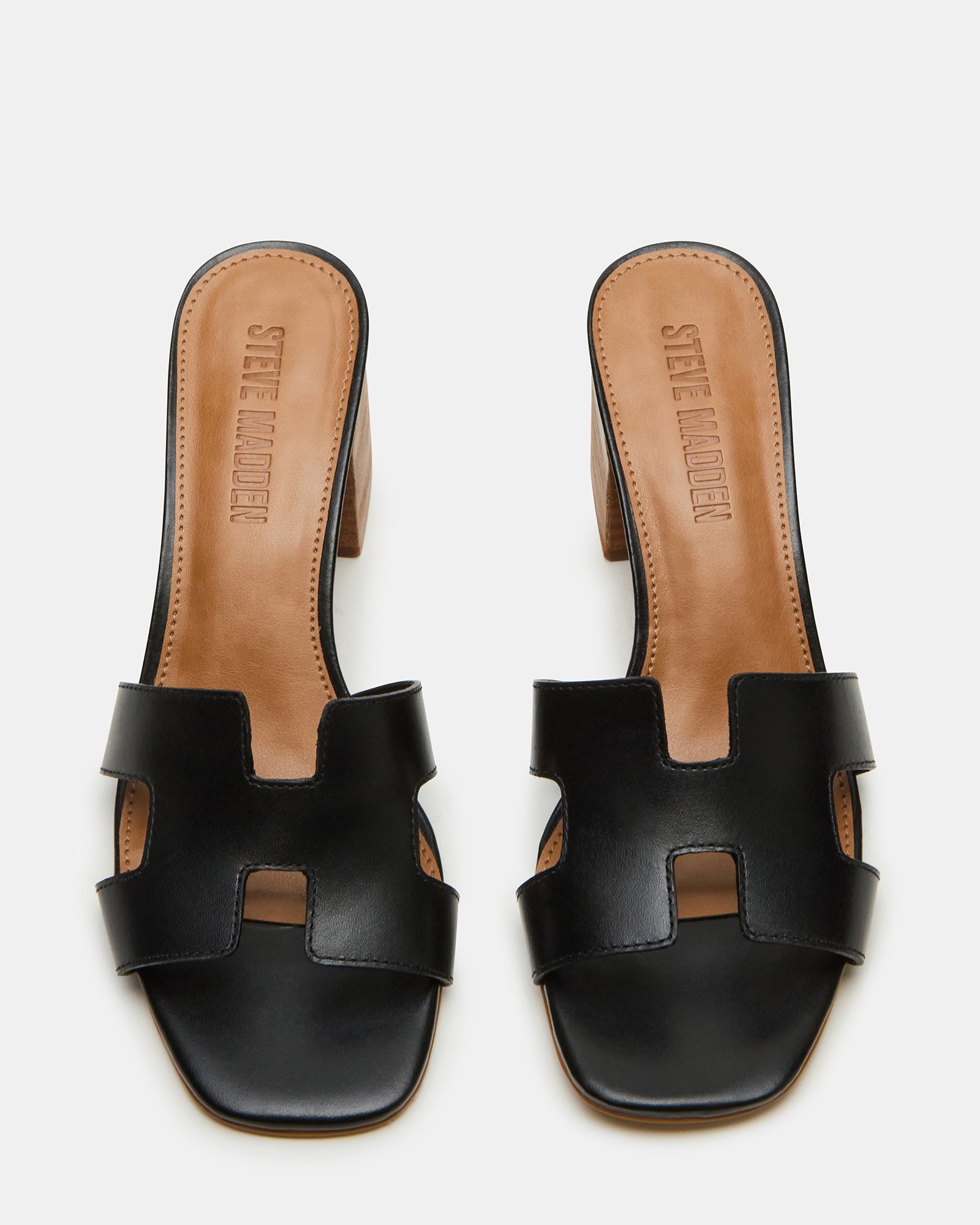Side view of HADES black leather sandals highlighting the block heel and square toe design