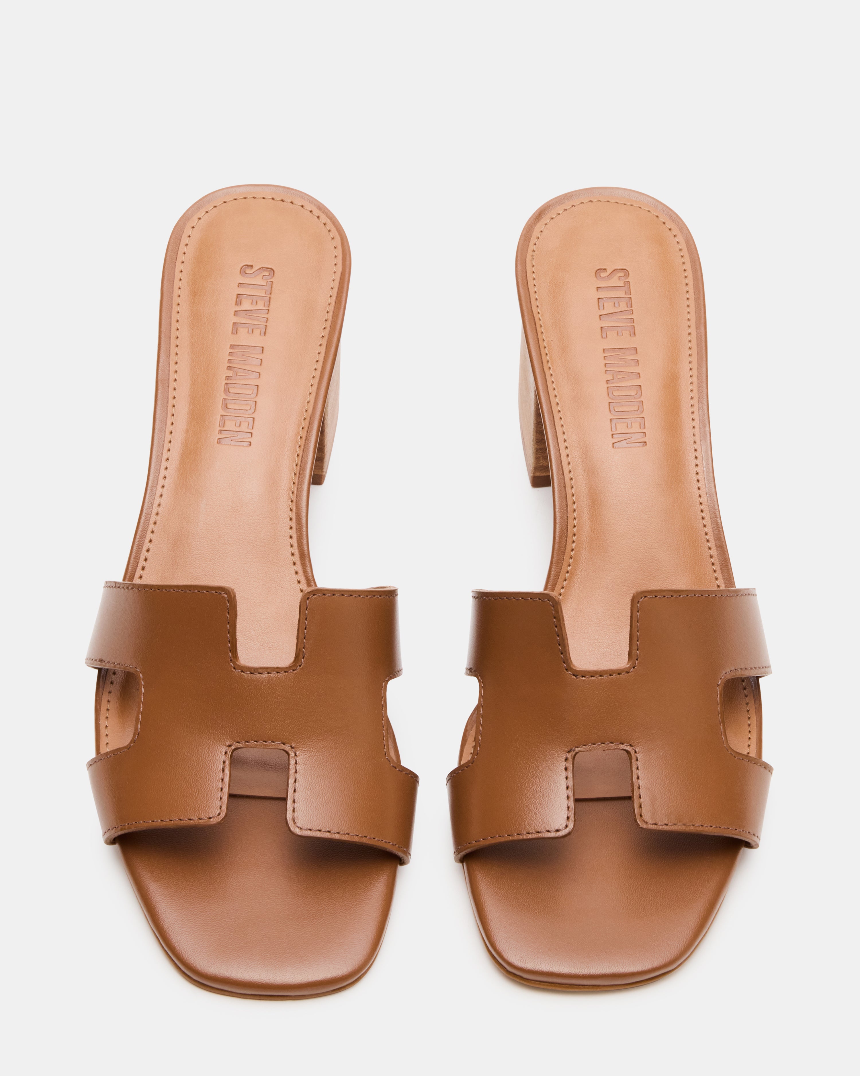 Front view of brown leather sandals highlighting square toe and block heel