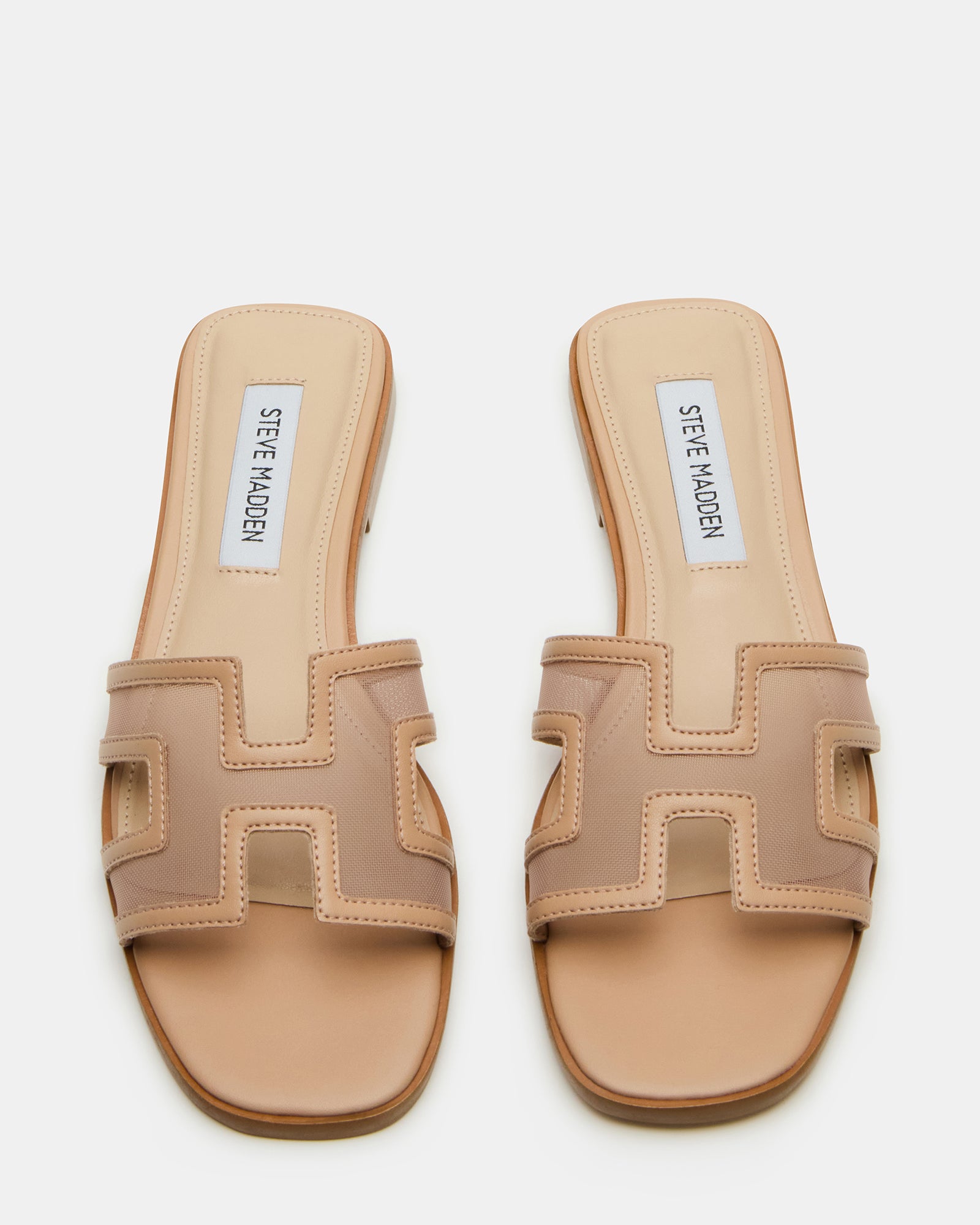 Side profile of blush mesh slide showing .75 inch heel and comfort fit