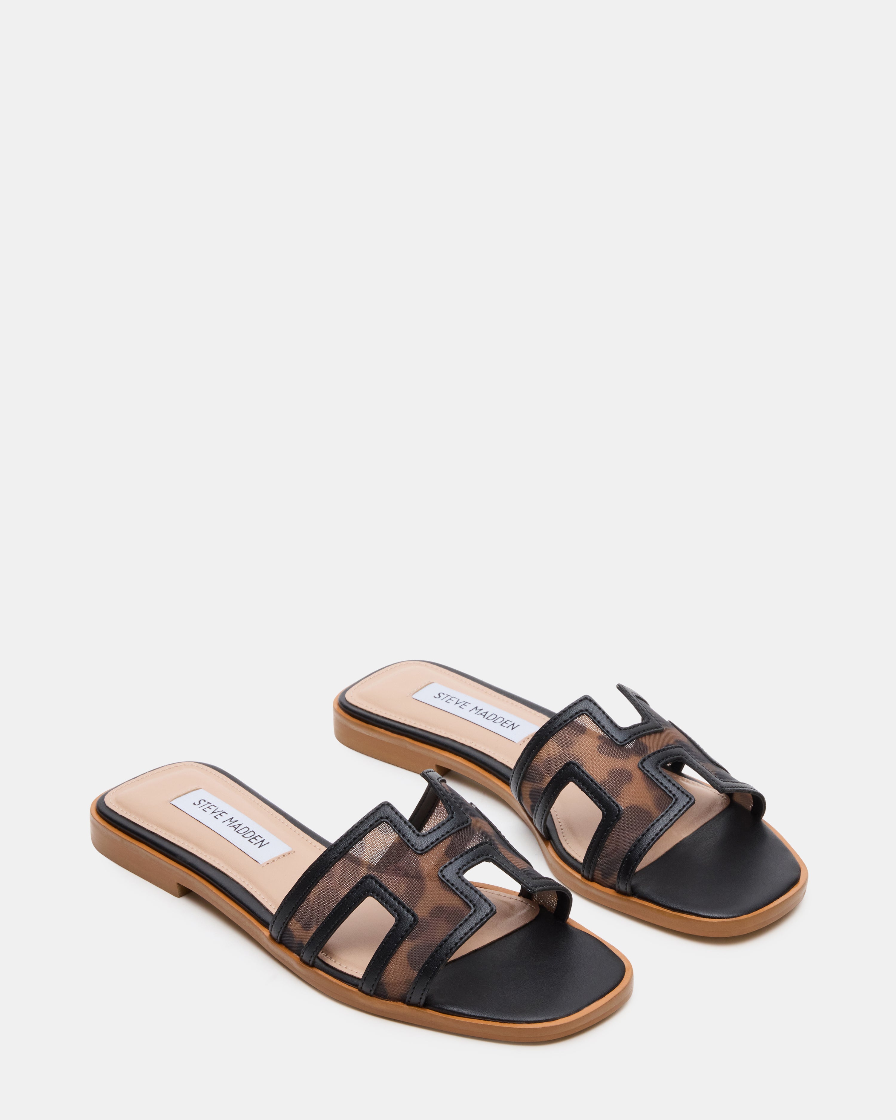 Close-up of the textured synthetic sole of the womens slide shoes