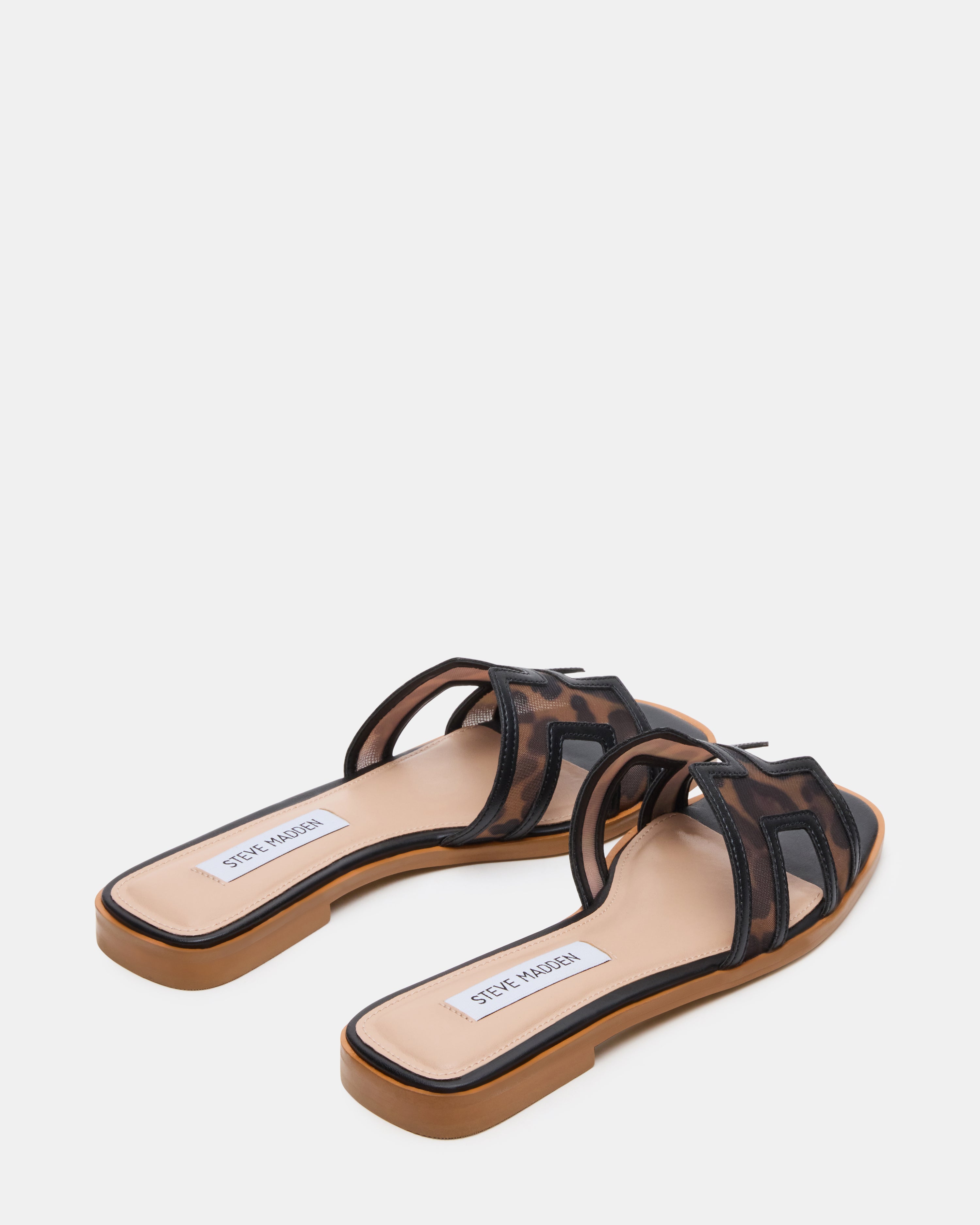 Close-up of the textured synthetic sole of the womens slide shoes