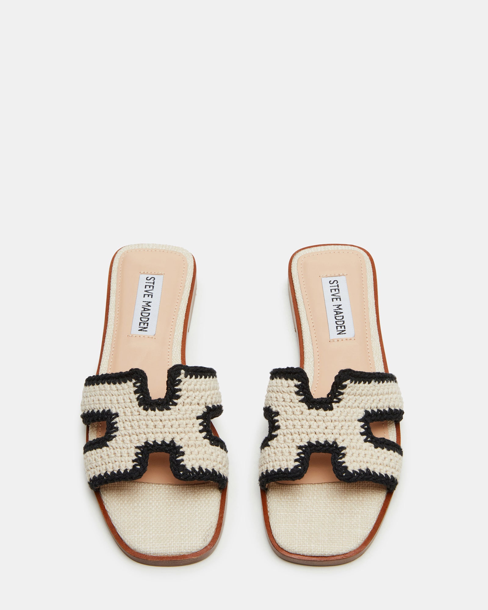 Cream multi sandals on feet, styled with casual summer outfit
