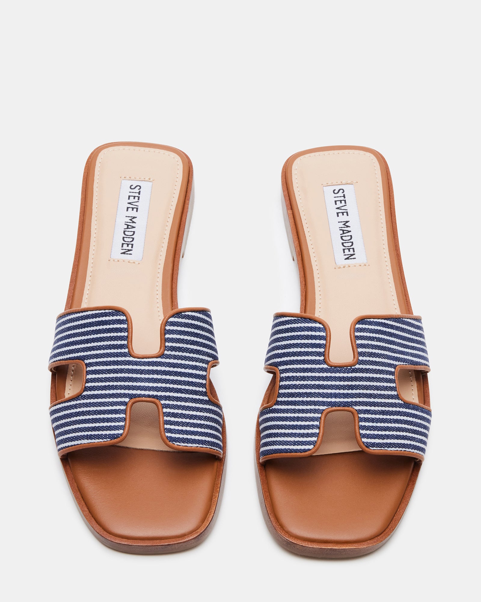 Model wearing navy multi flat slide sandals with a summer dress