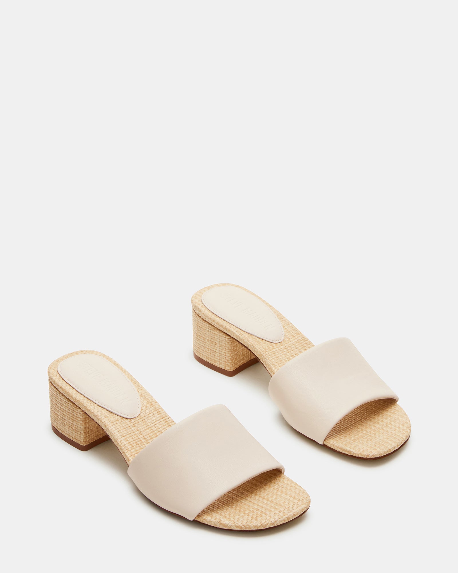 Side profile showcasing the 2-inch heel height of these brown leather sandals